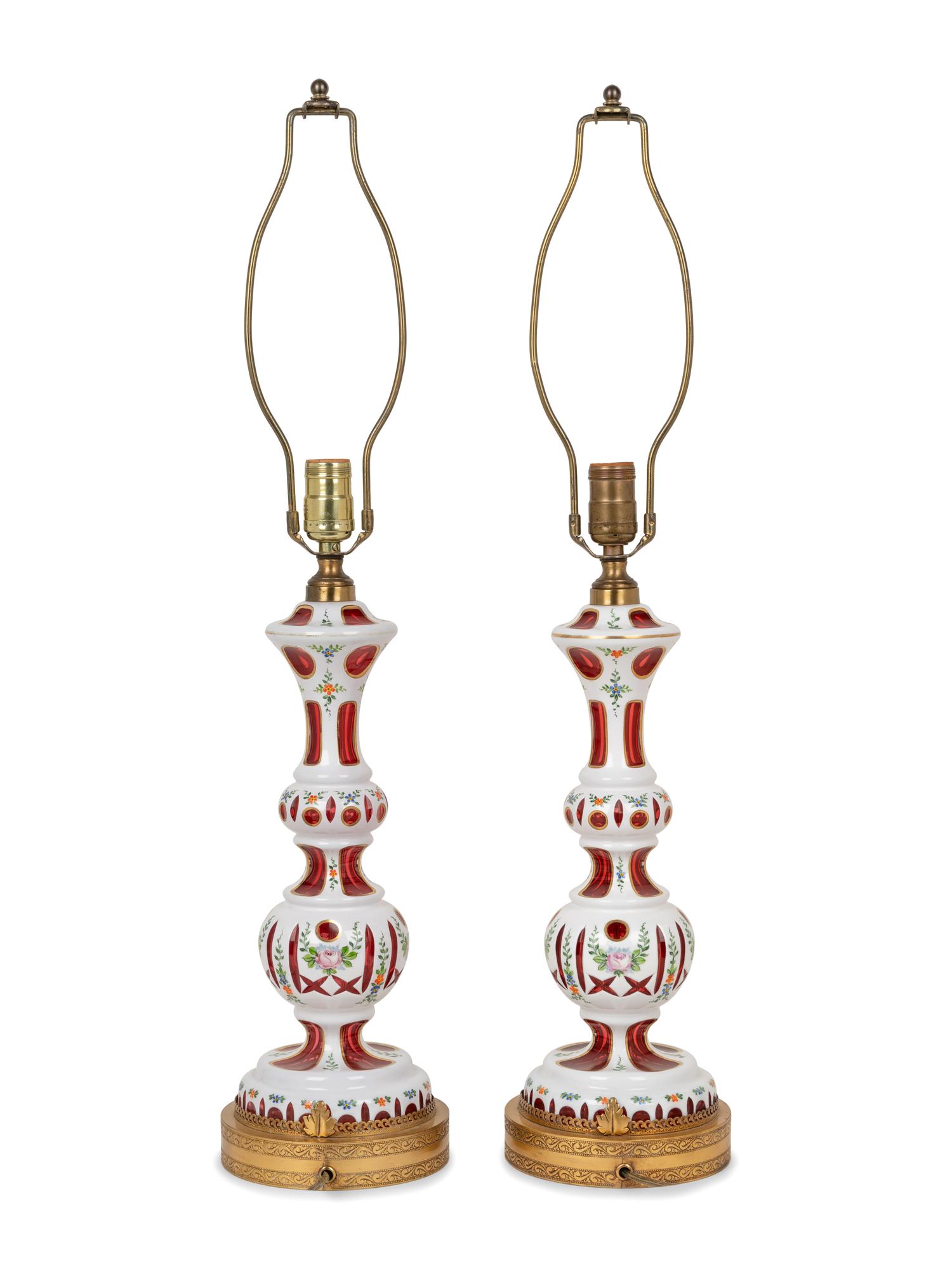 A Pair of Bohemian Enameled White Overlay Ruby Glass Lamps