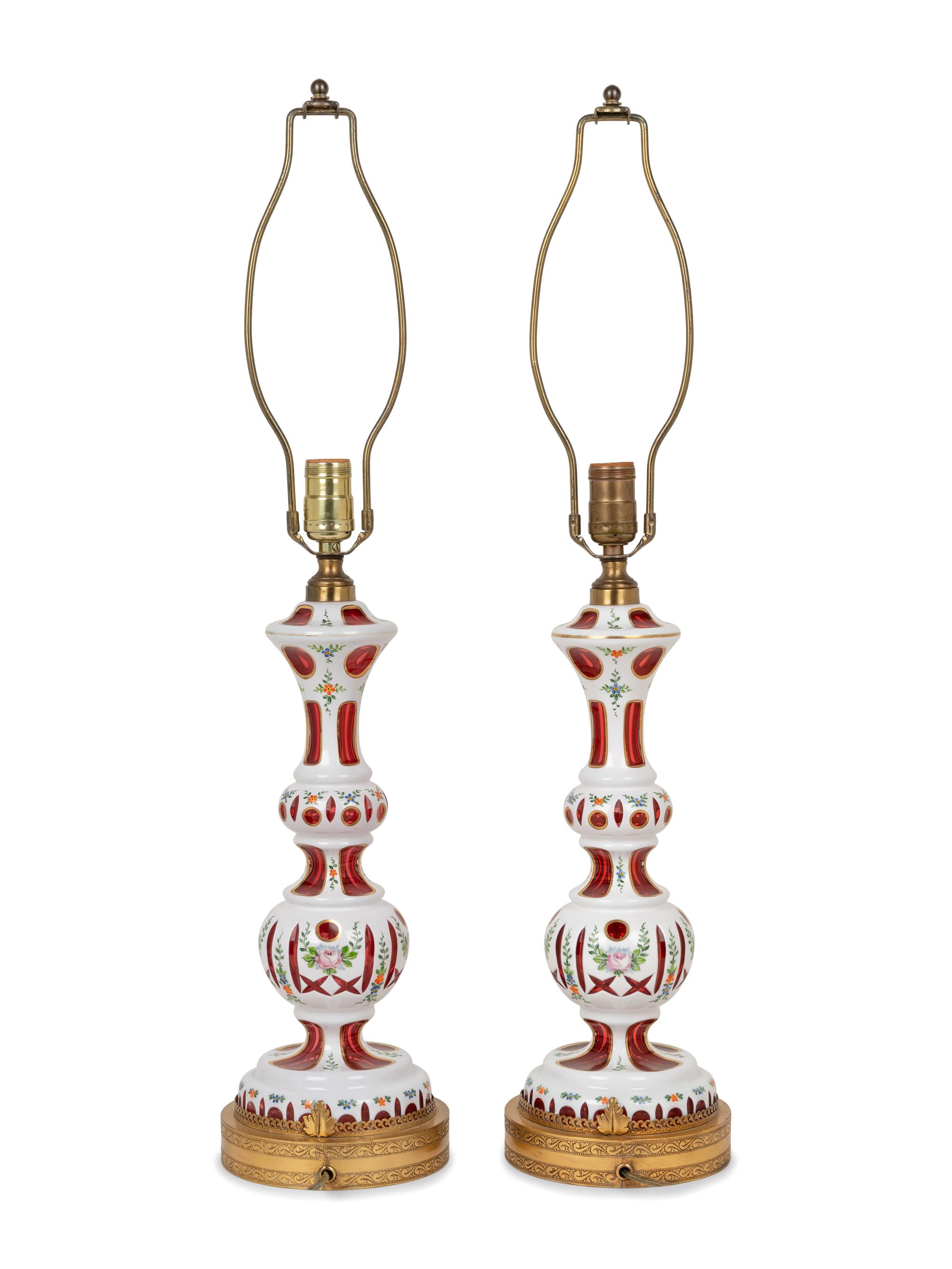 A Pair of Bohemian Enameled White Overlay Ruby Glass Lamps