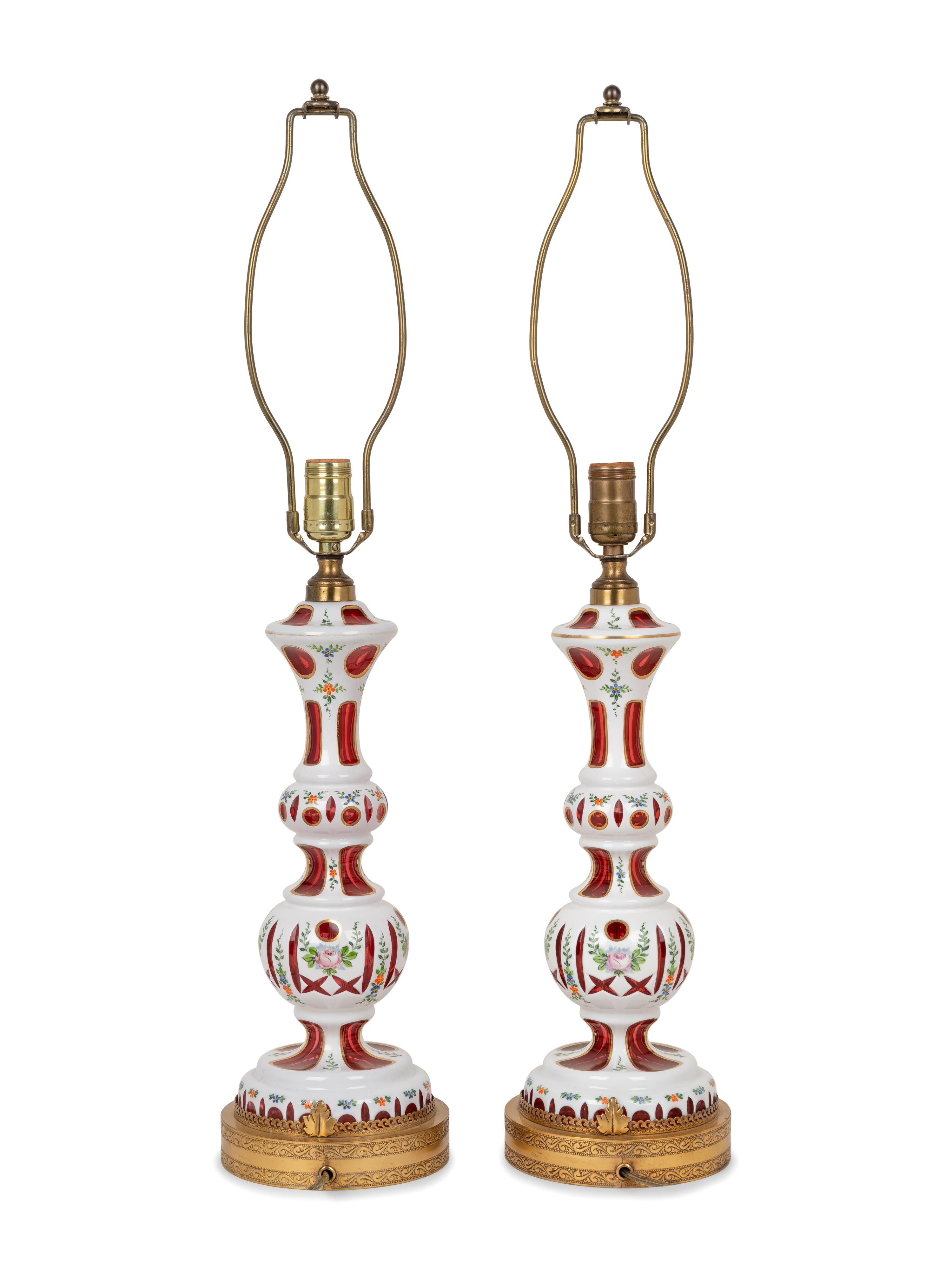 A Pair of Bohemian Enameled White Overlay Ruby Glass Lamps