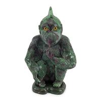 A Carved Ruby Zoisite Figure of a Seated Monkey