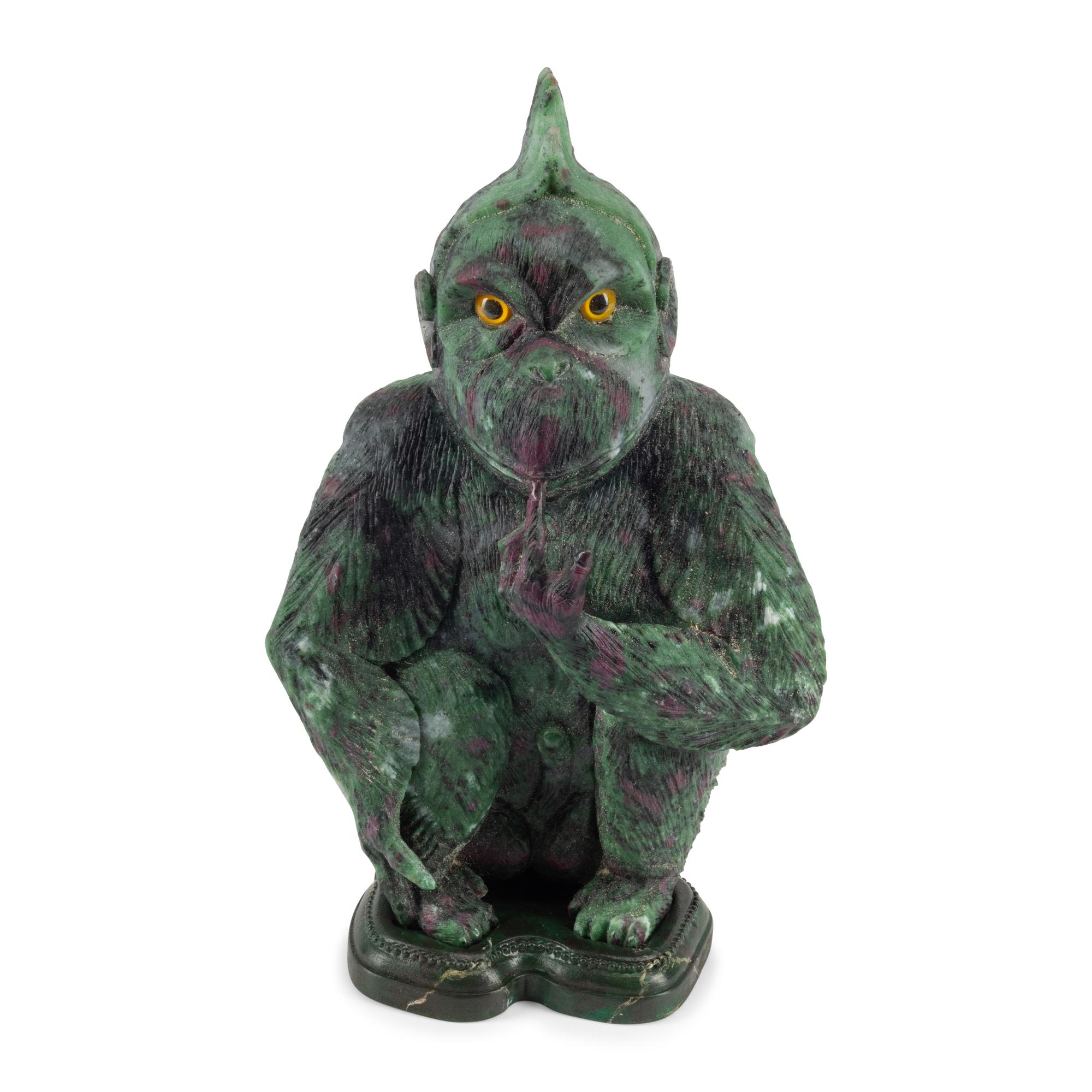 A Carved Ruby Zoisite Figure of a Seated Monkey