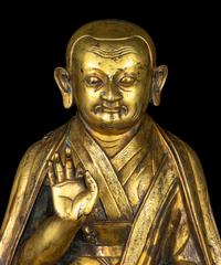 A Large Sino-Tibetan Gilt Bronze Figure of a Lama 巨型銅鎏金上師坐像