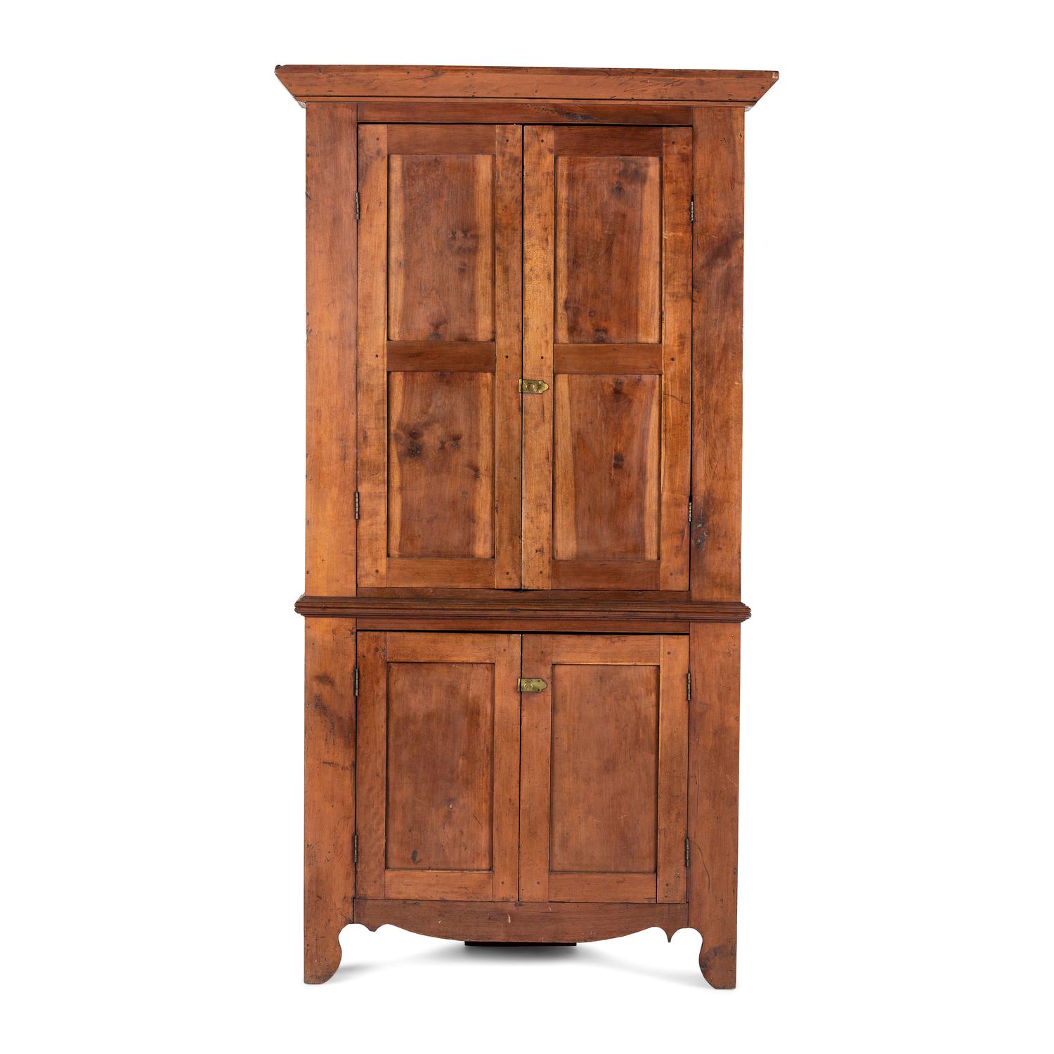 A Chippendale Paneled Cherrywood Corner Cupboard
