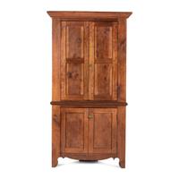 A Chippendale Paneled Cherrywood Corner Cupboard