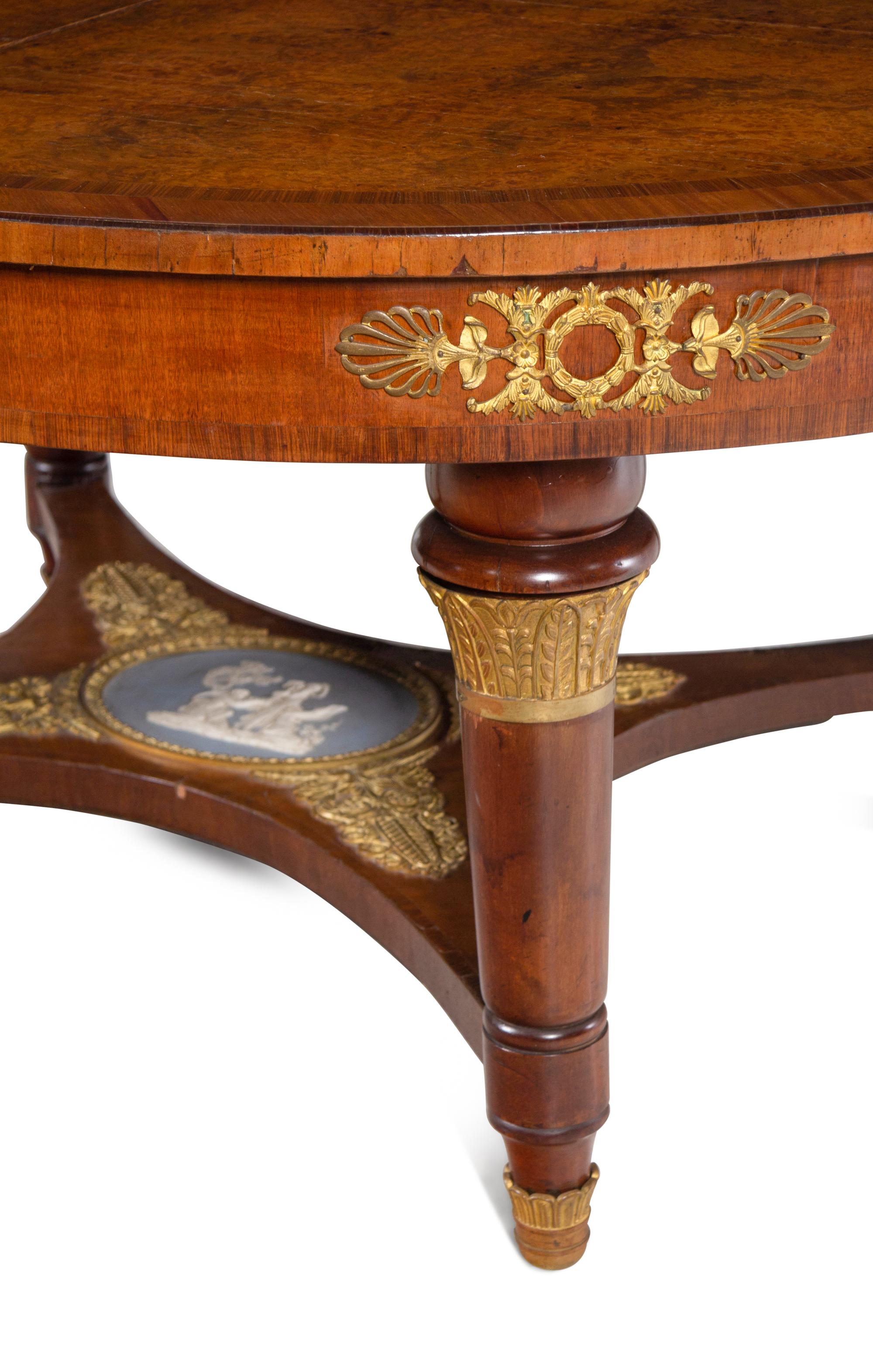 A French Gilt Bronze and Jasperware Mounted Burlwood Dining Suite