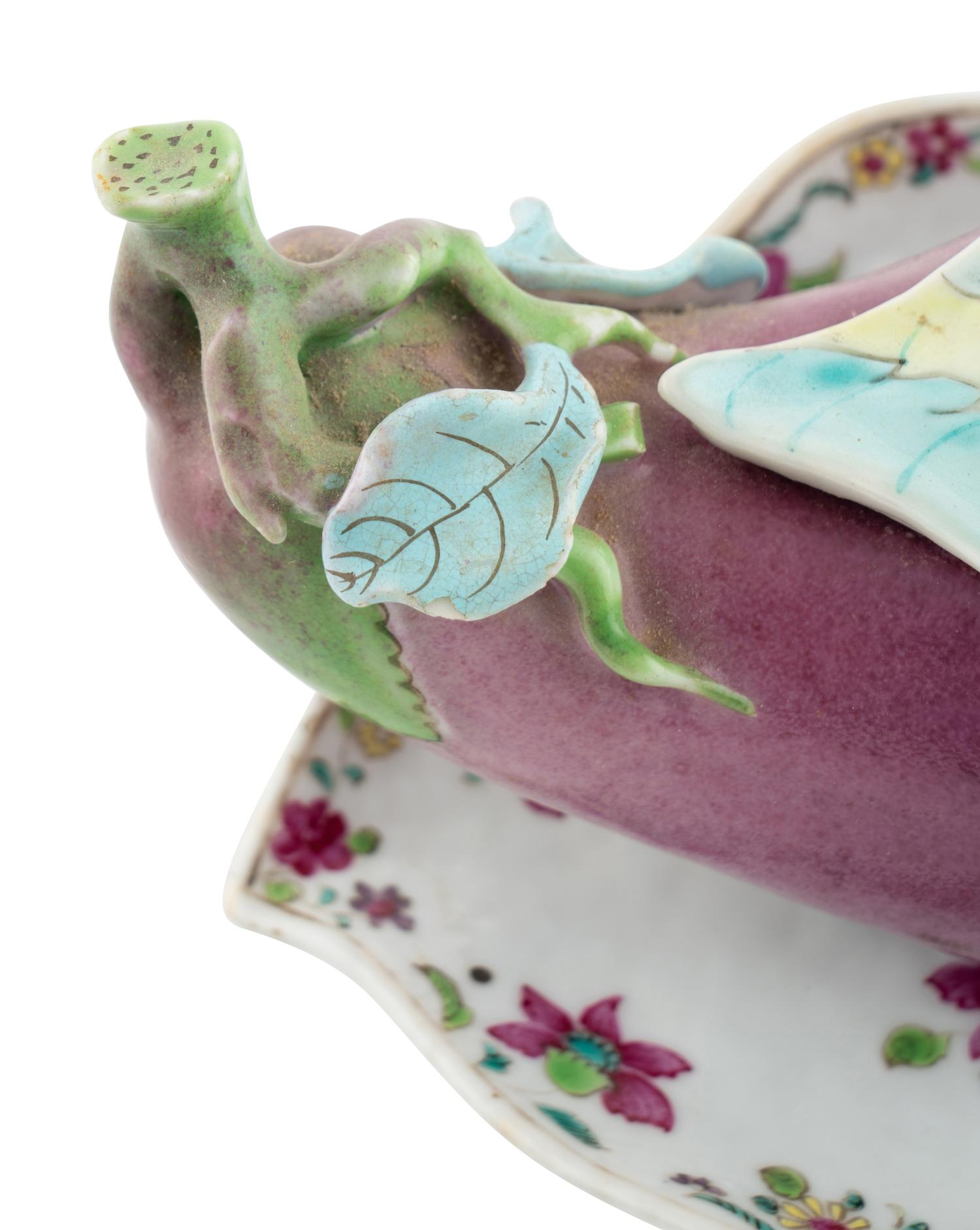 A Chinese Export "Tobacco Leaf" Porcelain Eggplant-Form Sauce Tureen and Underplate