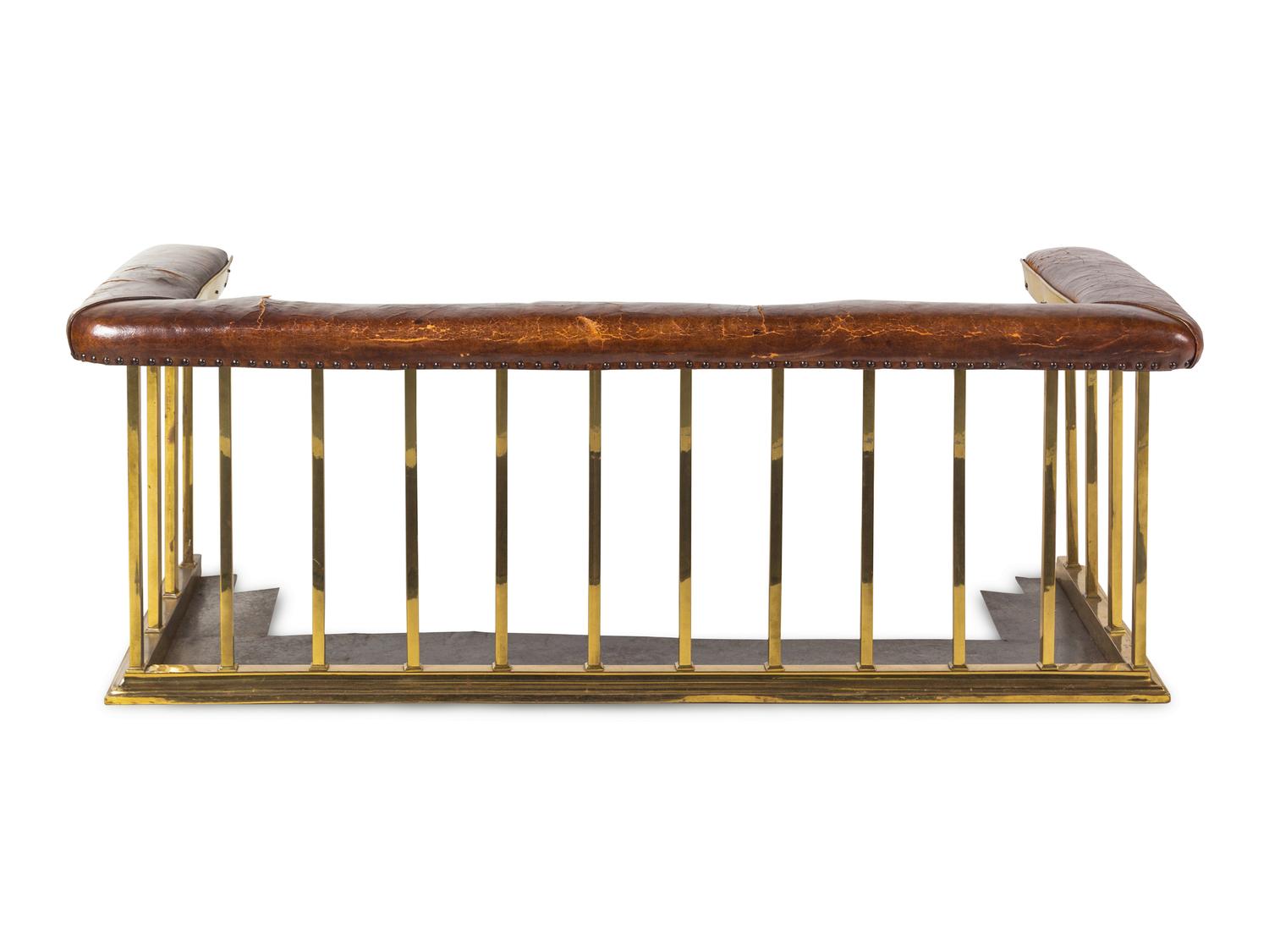 An English Leather-Upholstered Brass Club Fender