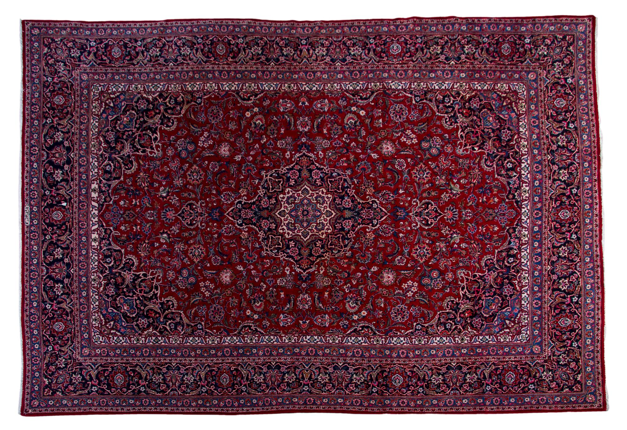 A Kashan Wool Rug, 12 feet 4 inches x 8 feet 8 inches.