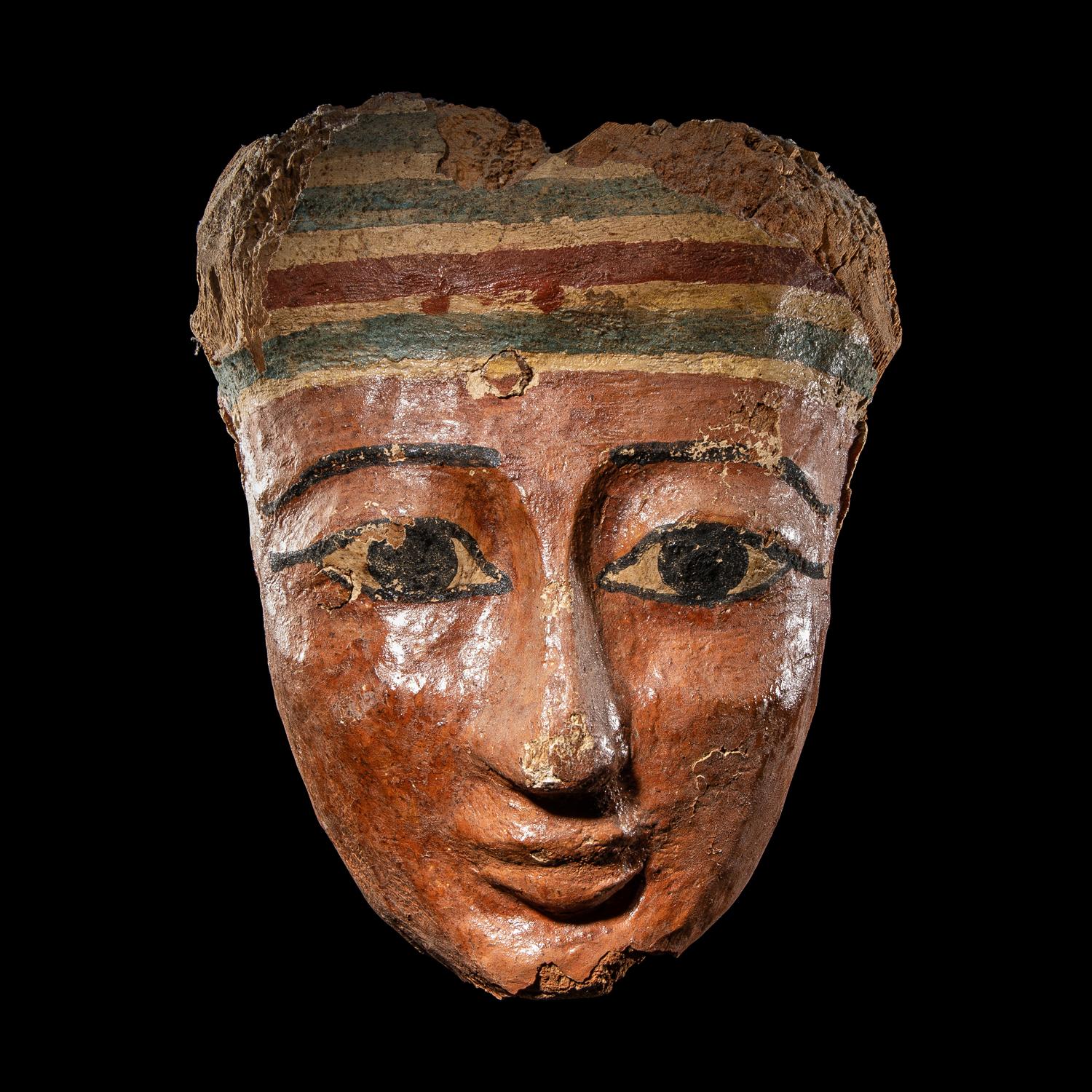 An Egyptian Painted Wood Mummy Mask