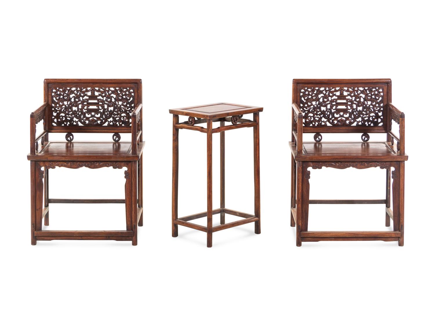 A Pair of Huali Low-Backed Armchairs and Matching Stand Table