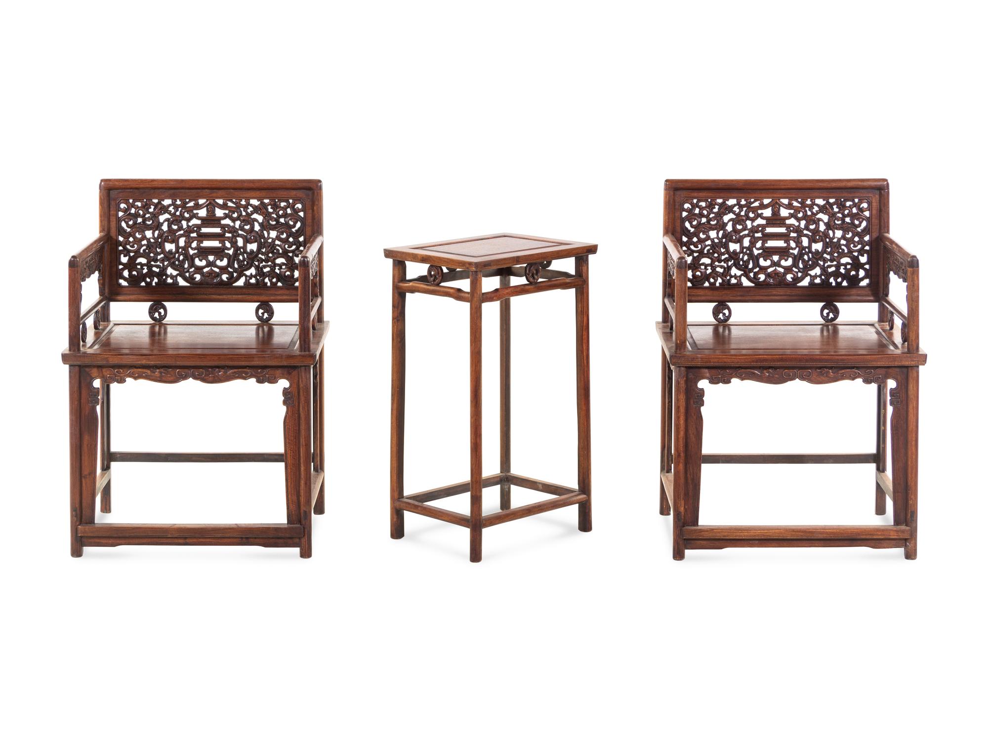 A Pair of Huali Low-Backed Armchairs and Matching Stand Table