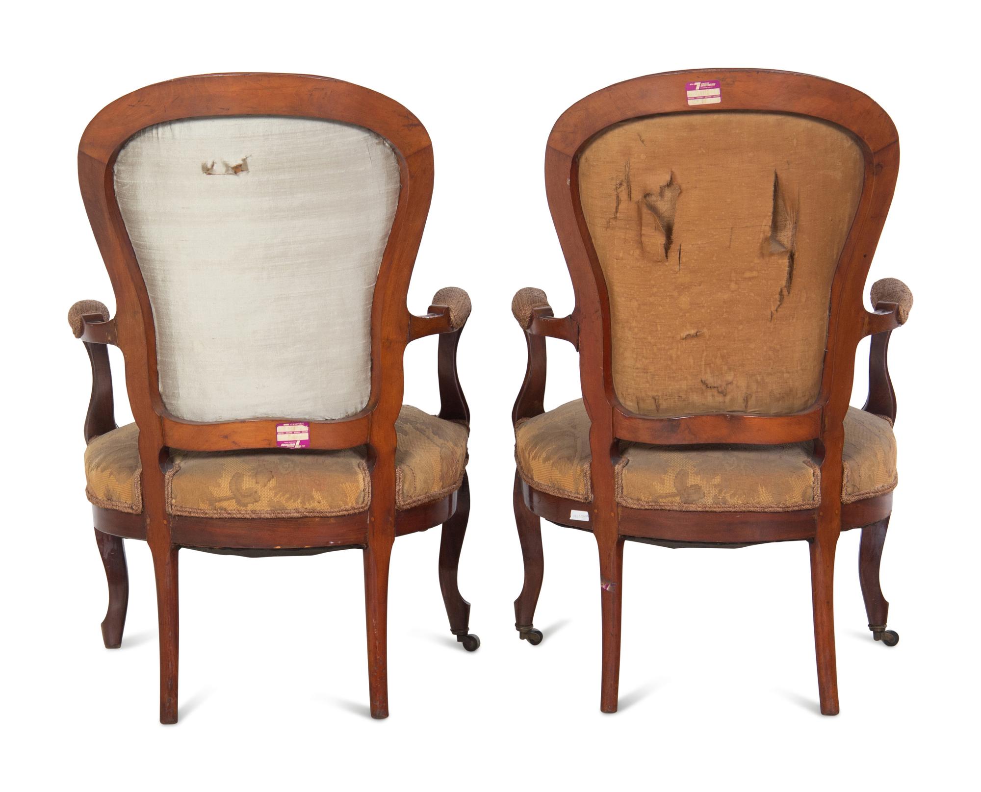 A Pair of Victorian Rococo Revival Walnut Armchairs