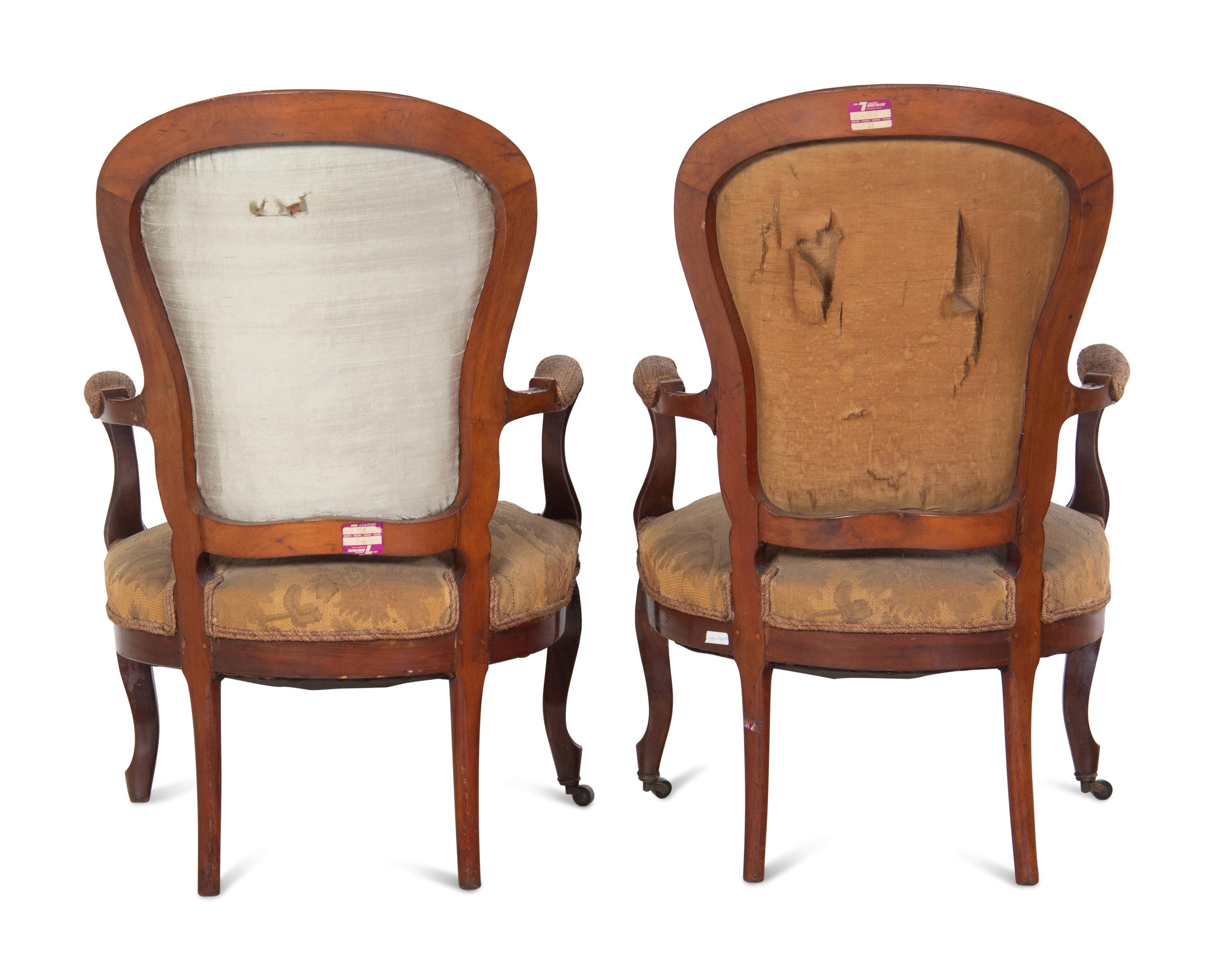 A Pair of Victorian Rococo Revival Walnut Armchairs
