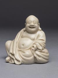 A Blanc-de-Chine Porcelain Figure of Budai Buddha