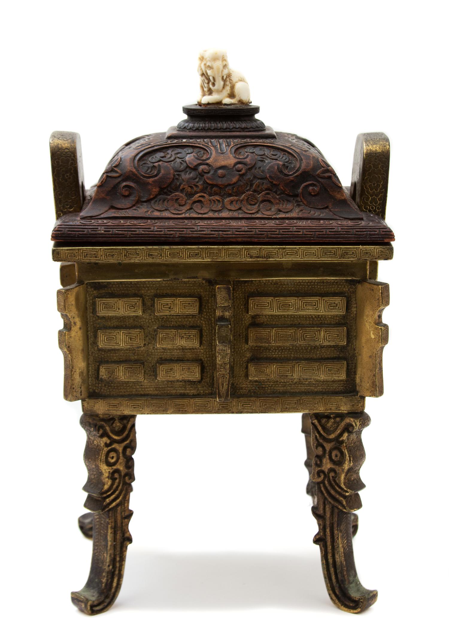 A Chinese Bronze Censer with Carved Wood Lid Height 13 x width 8 x depth 6 1/2 inches. — 19TH CENTURY