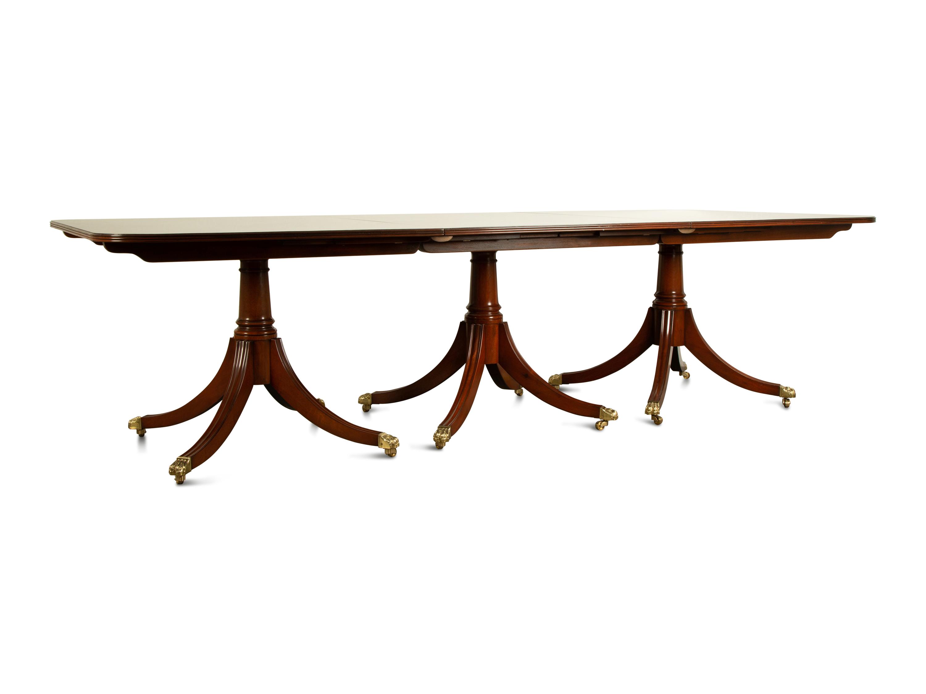 A Regency Style Mahogany Triple Pedestal Dining Table — 20TH CENTURY