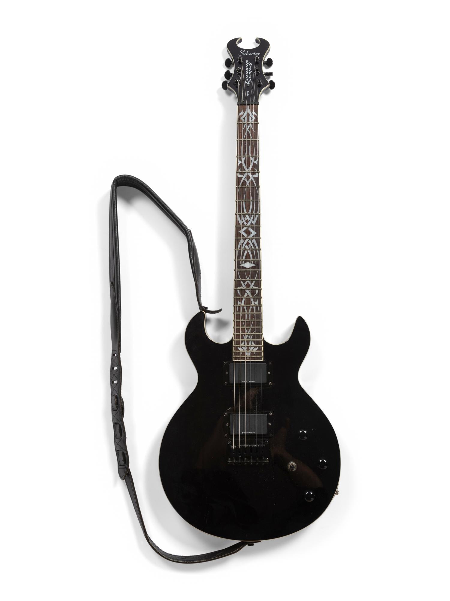 A Schecter Diamond Series Mother-of-Pearl Inlaid Devil Electric Guitar