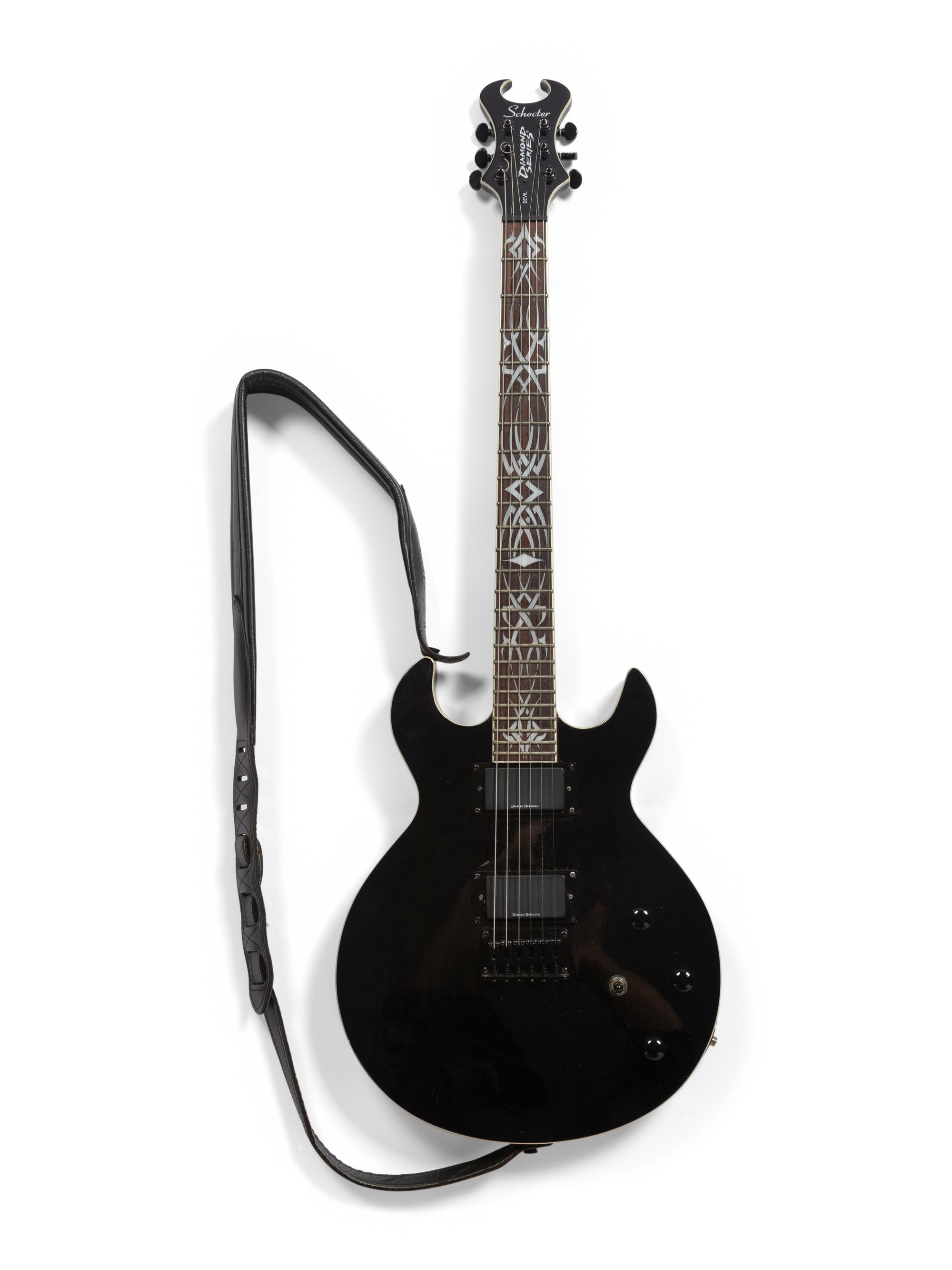 A Schecter Diamond Series Mother-of-Pearl Inlaid Devil Electric Guitar