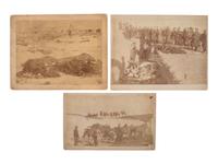 [WOUNDED KNEE]. Four photographs taken in the immediate aftermath of Wounded Knee, incl. Lt. Sydney Cloman on the battlefield surrounded by dead Lakota members of Big Foot’s Band. January 1891.