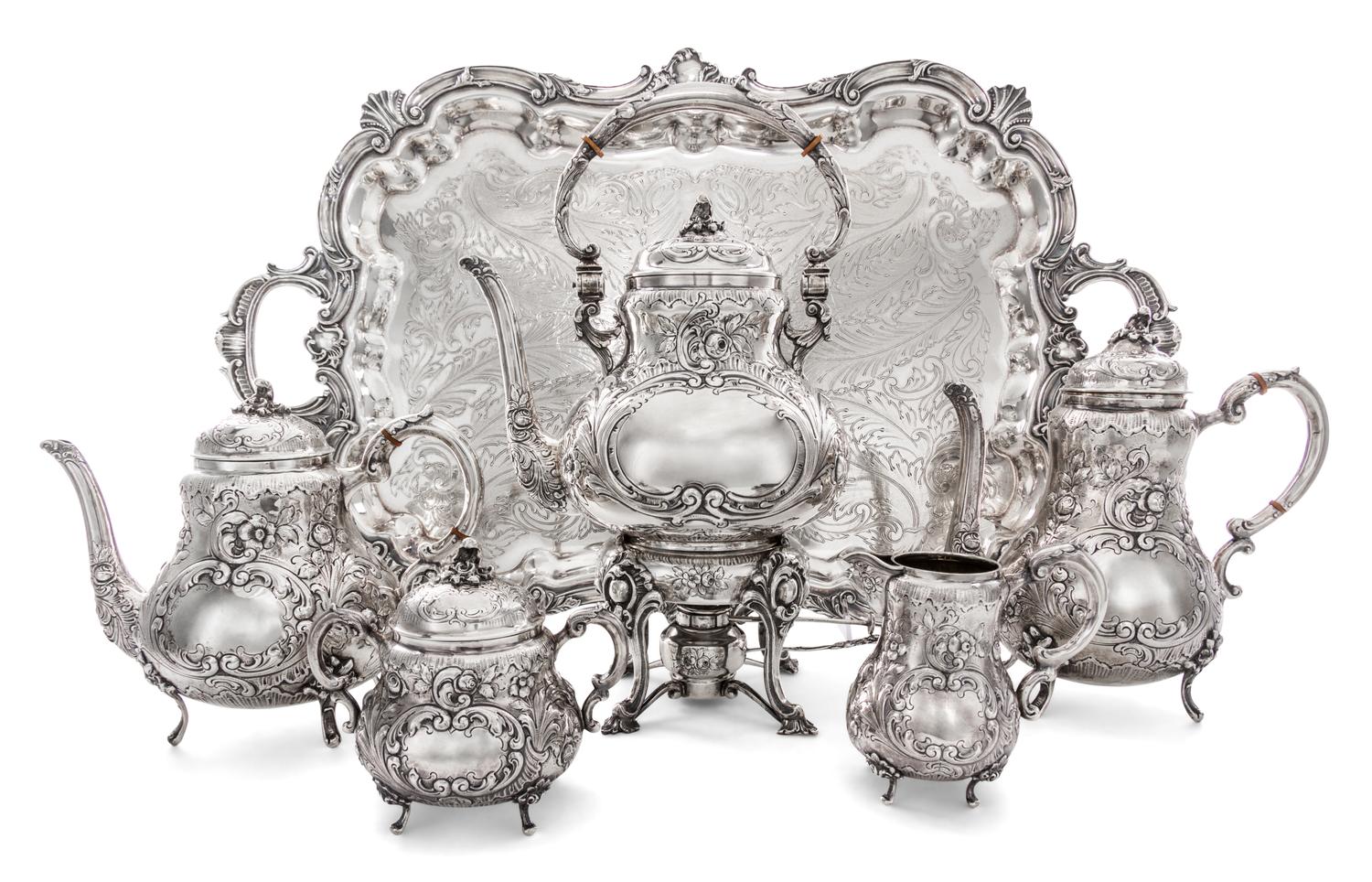 An American Silver Five-Piece Tea and Coffee Service, 19th/20th Century, each with allover foliate repousse decoration, comprising a ke