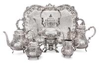 An American Silver Five-Piece Tea and Coffee Service, 19th/20th Century, each with allover foliate repousse decoration, comprising a ke