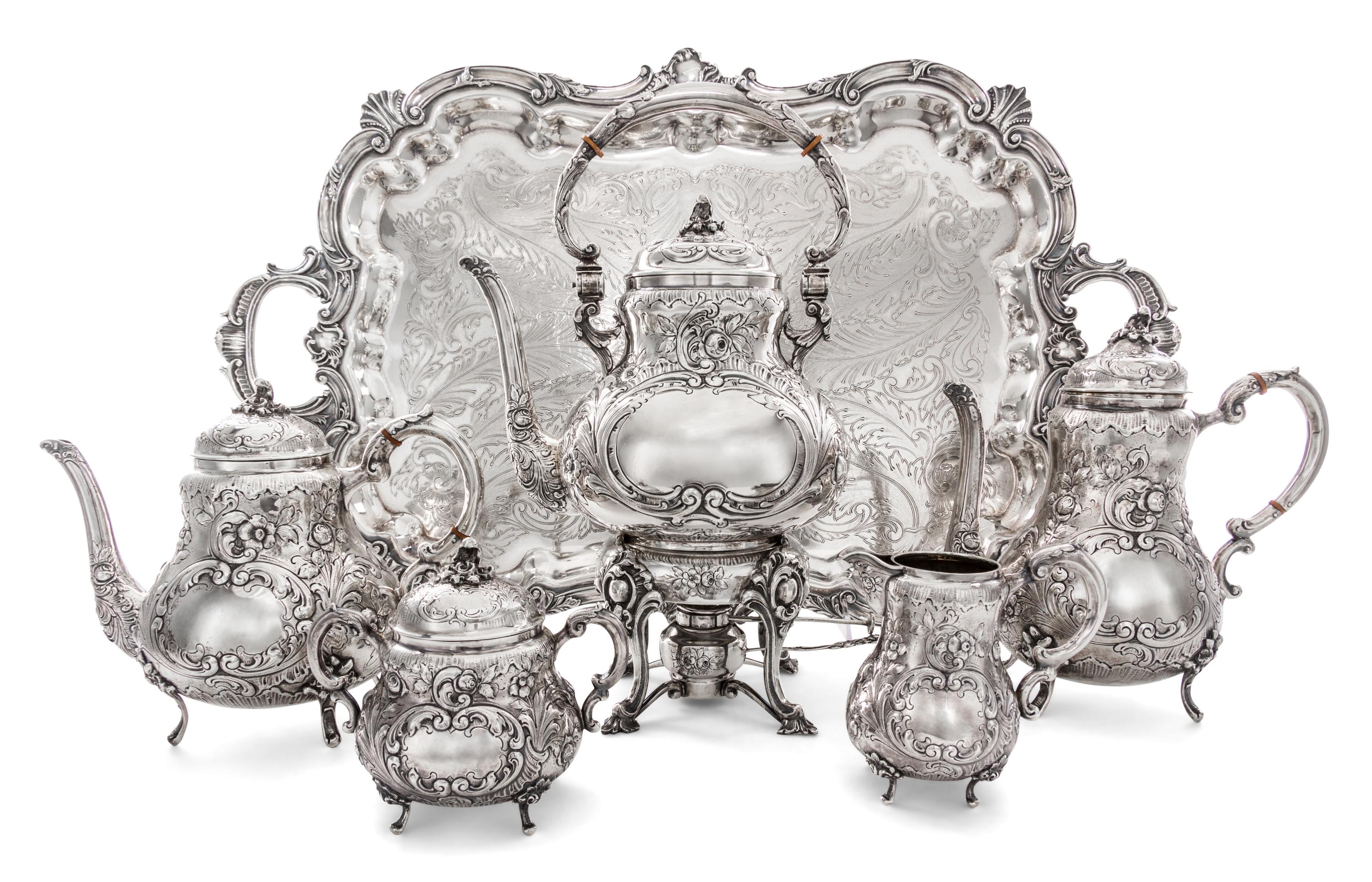 An American Silver Five-Piece Tea and Coffee Service, 19th/20th Century, each with allover foliate repousse decoration, comprising a ke