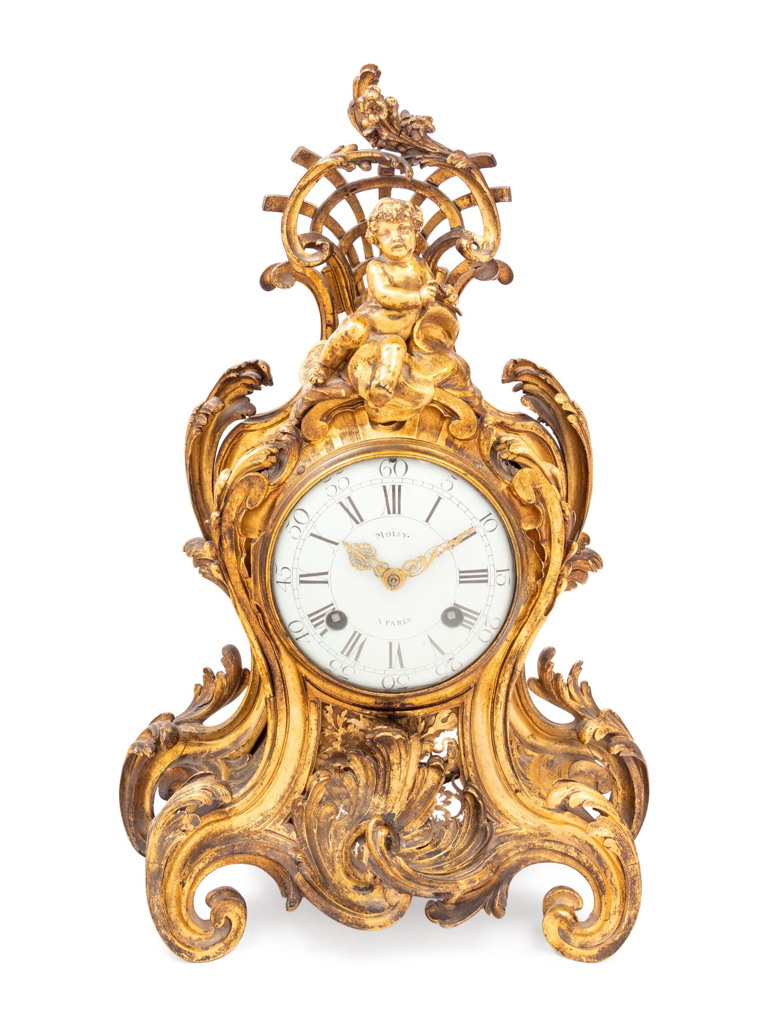 A Louis XV Gilt Bronze Clock and Stand