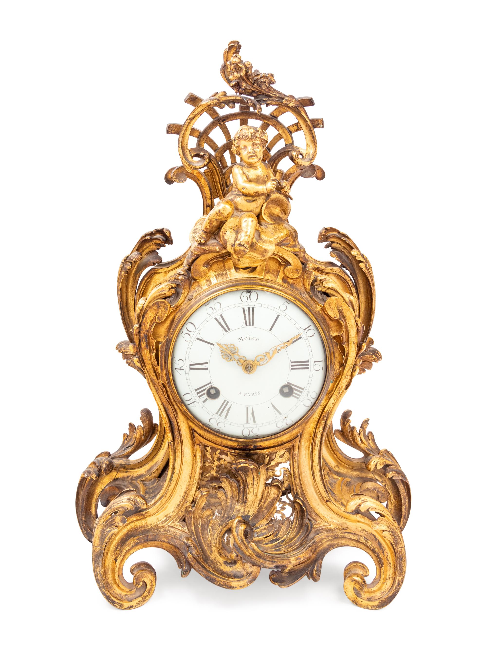 A Louis XV Gilt Bronze Clock and Stand