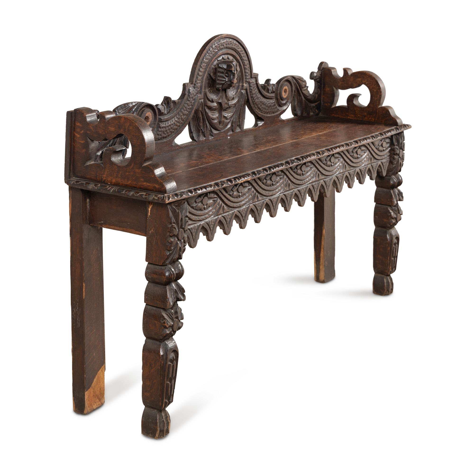 An Italian Carved Oak Hall Bench