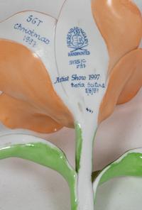 A Collection of Five Ceramic and Porcelain Flowers