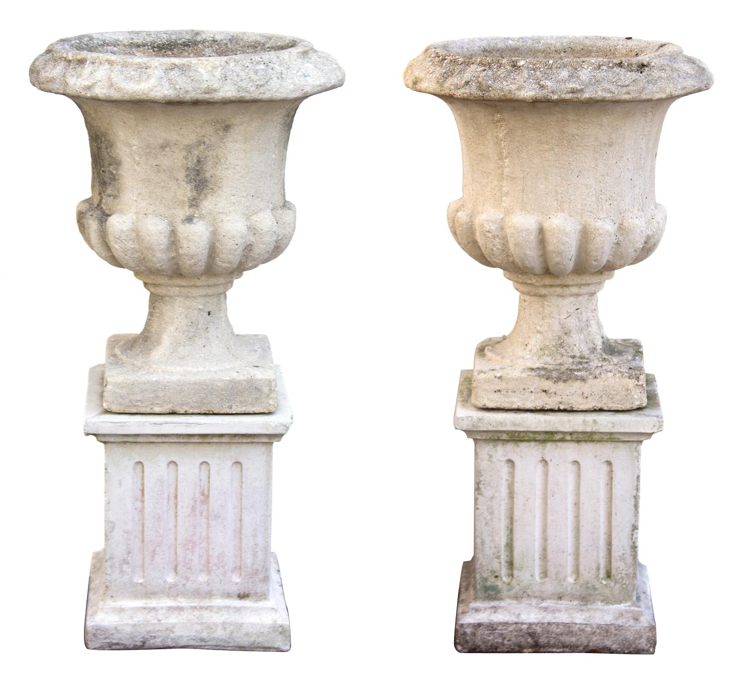 A Pair of Composite Stone Campana Garden Urns Height 35 1/2 x diameter 17 inches.