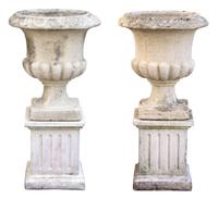 A Pair of Composite Stone Campana Garden Urns Height 35 1/2 x diameter 17 inches.