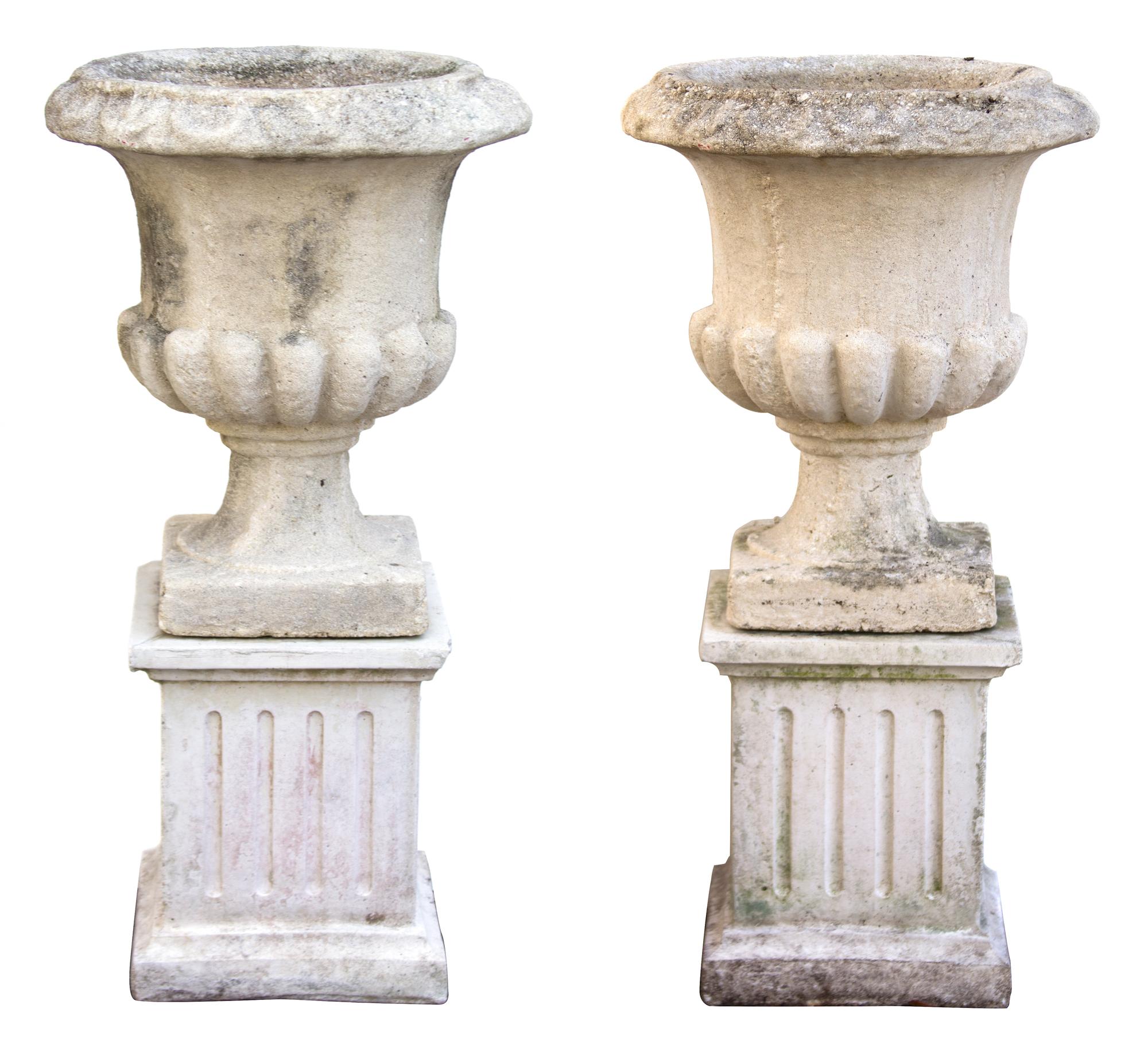 A Pair of Composite Stone Campana Garden Urns Height 35 1/2 x diameter 17 inches.