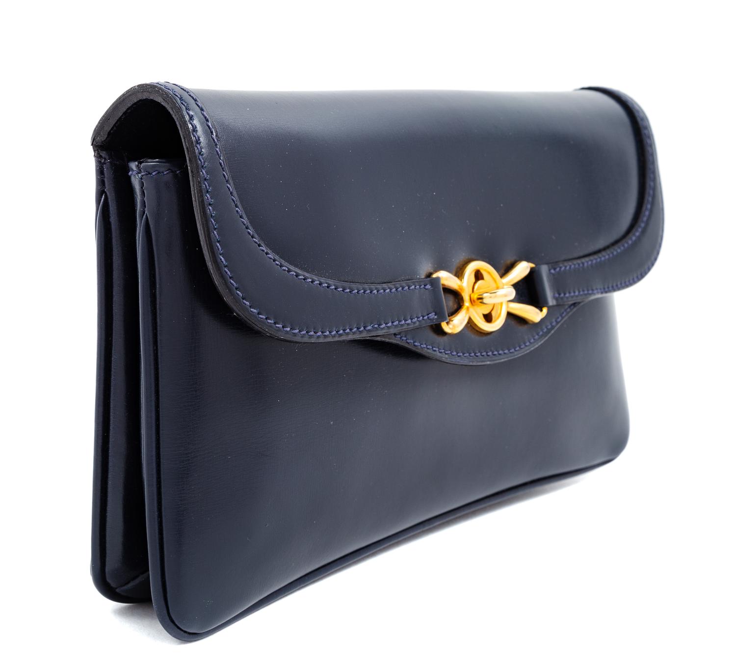 A Gucci Navy Leather Vintage Rectangular Clutch, 5.5" H x 10" W x 1" D.