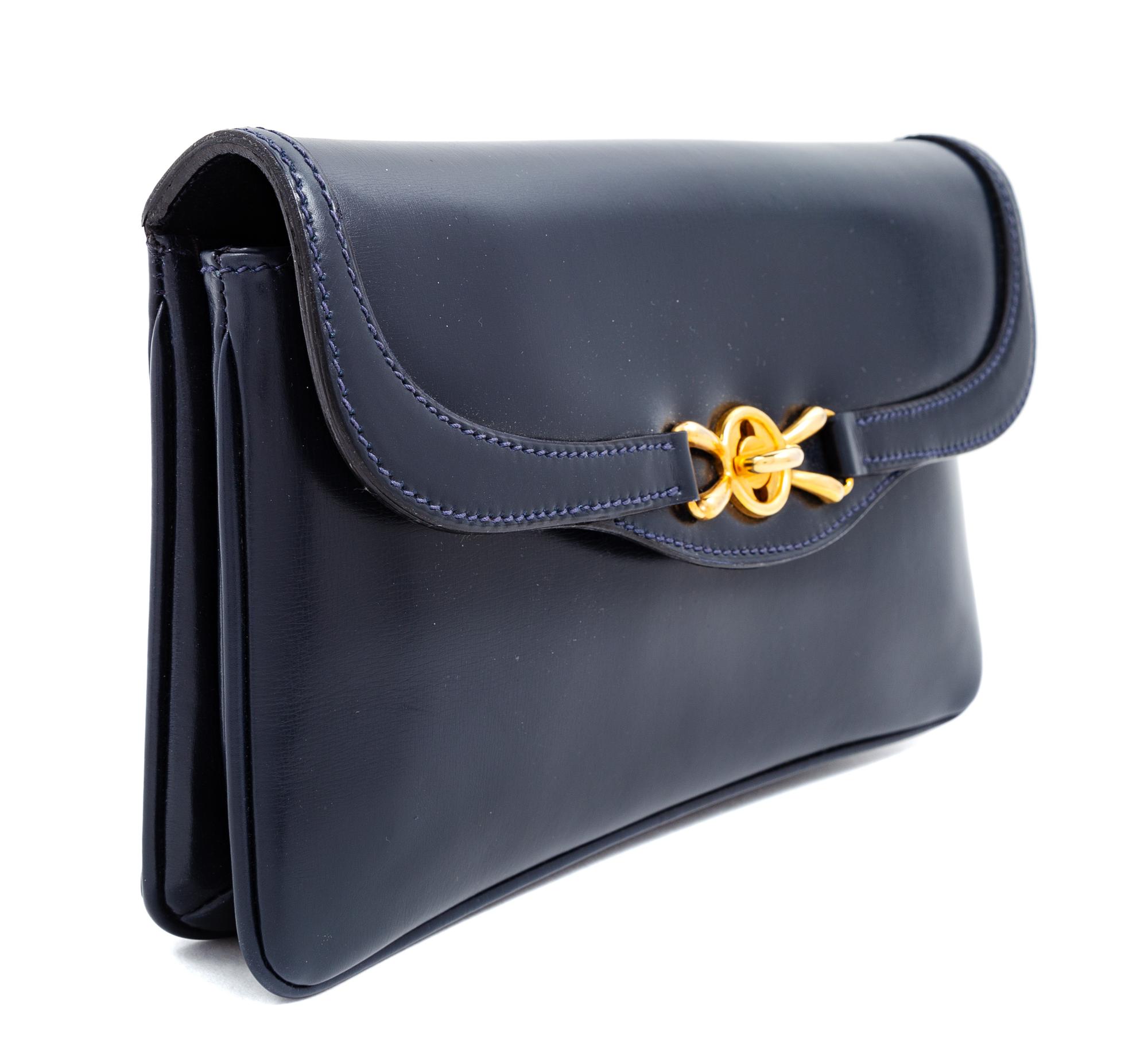 A Gucci Navy Leather Vintage Rectangular Clutch, 5.5" H x 10" W x 1" D.