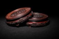 A Pair of Chinese Carved Hardwood Circular Stands