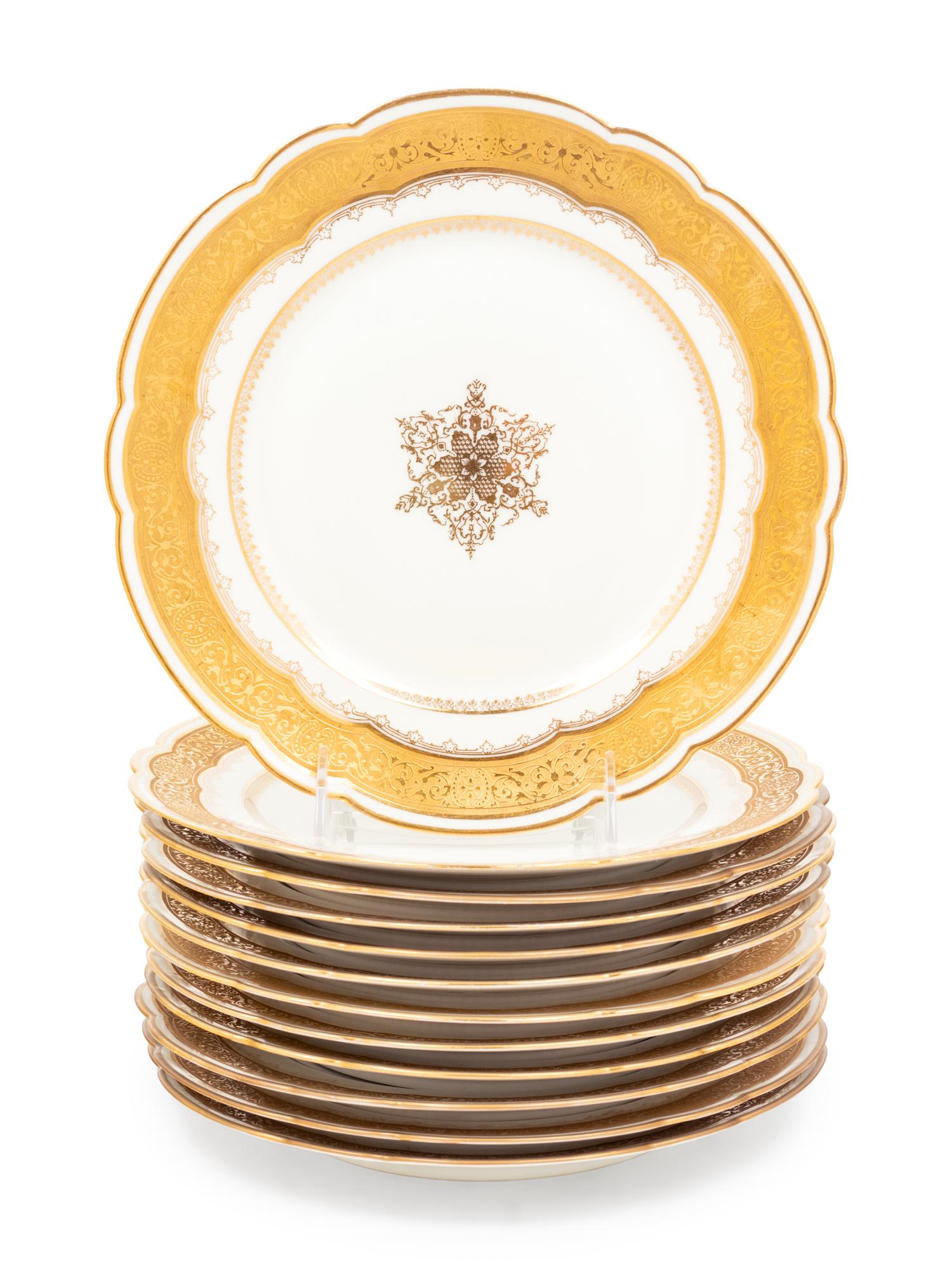 A Set of Twelve Limoges Gilt Decorated Porcelain Plates