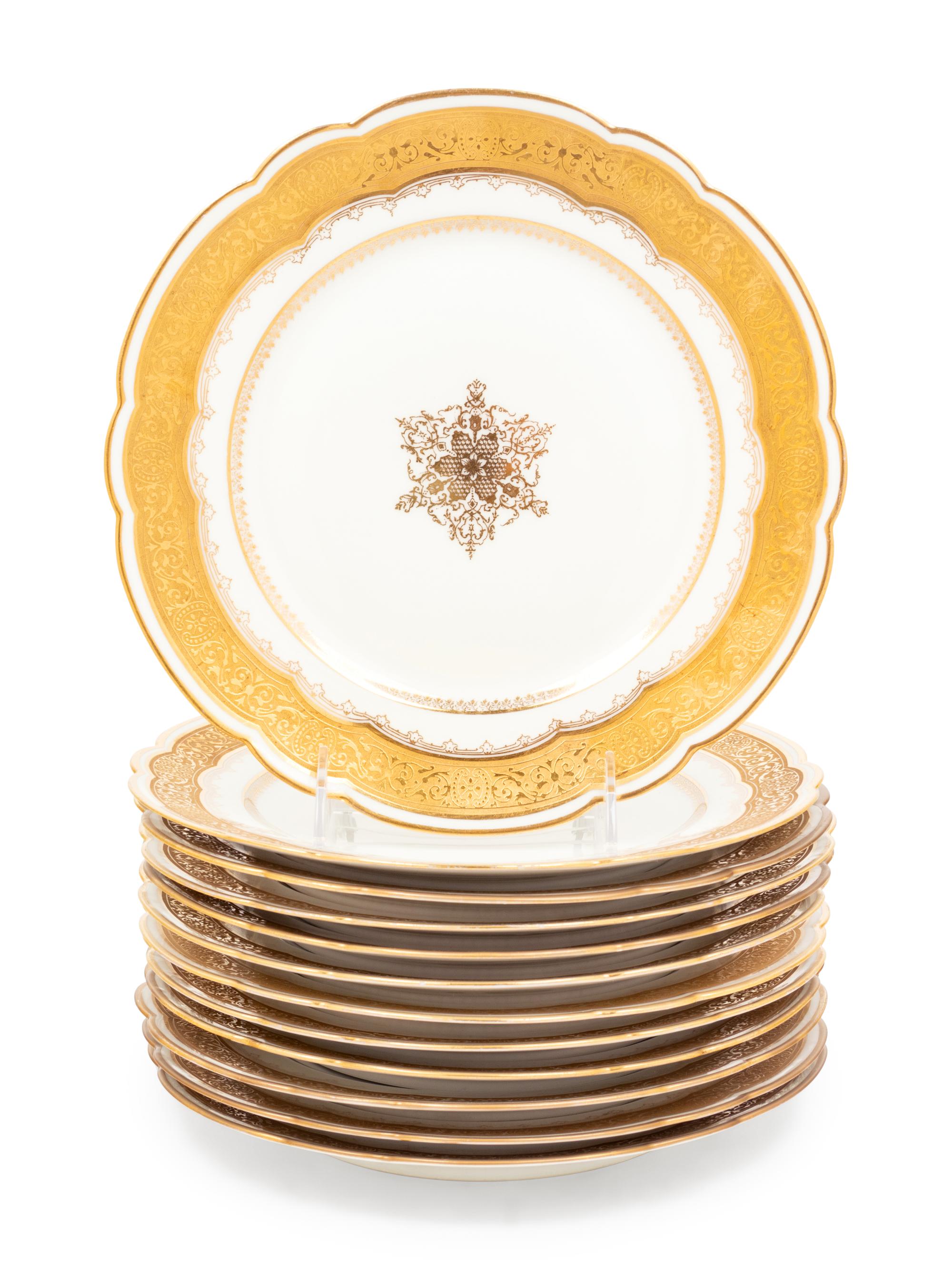 A Set of Twelve Limoges Gilt Decorated Porcelain Plates