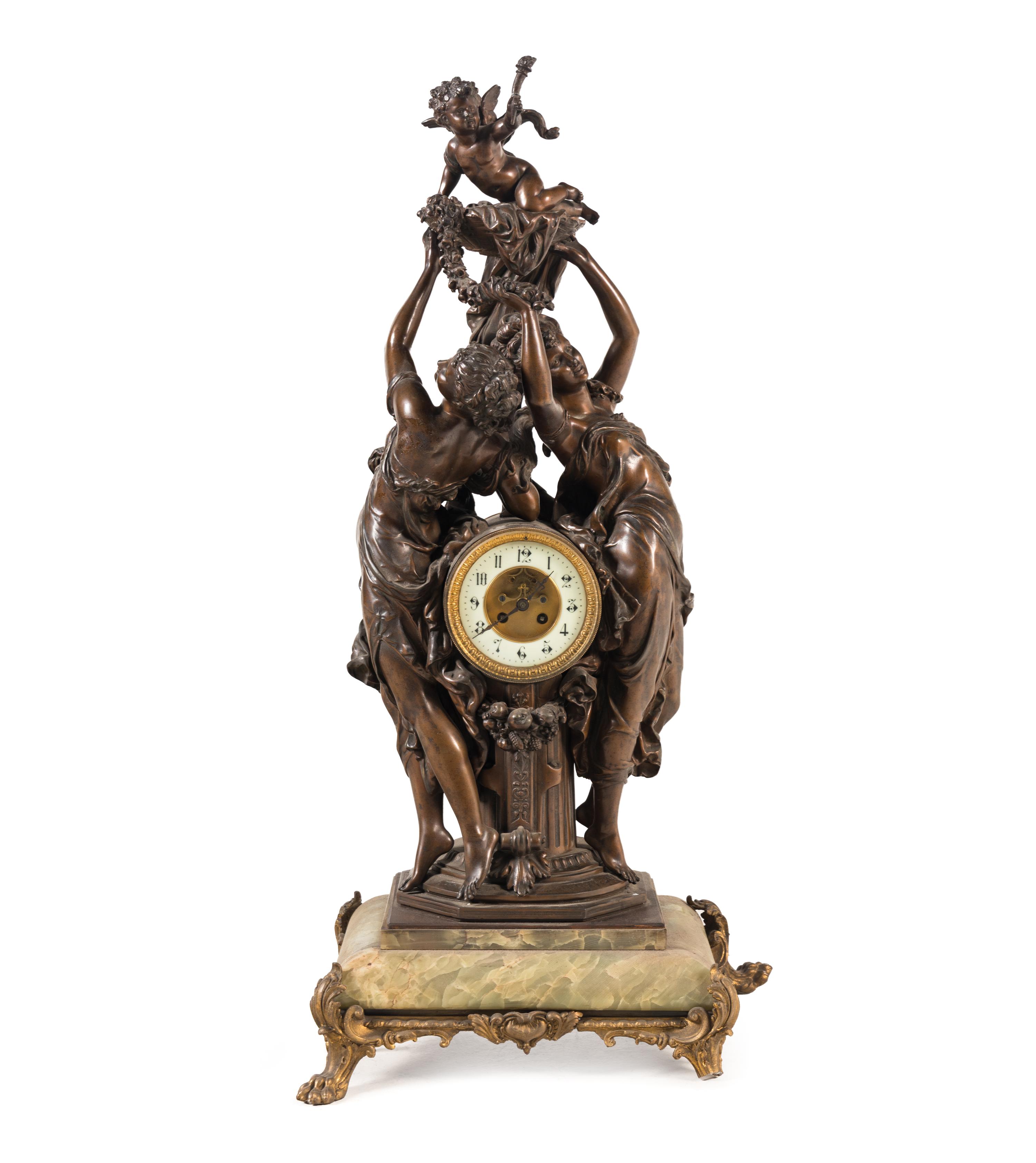 A Continental Cast Metal and Onyx Figural Mantel Clock
