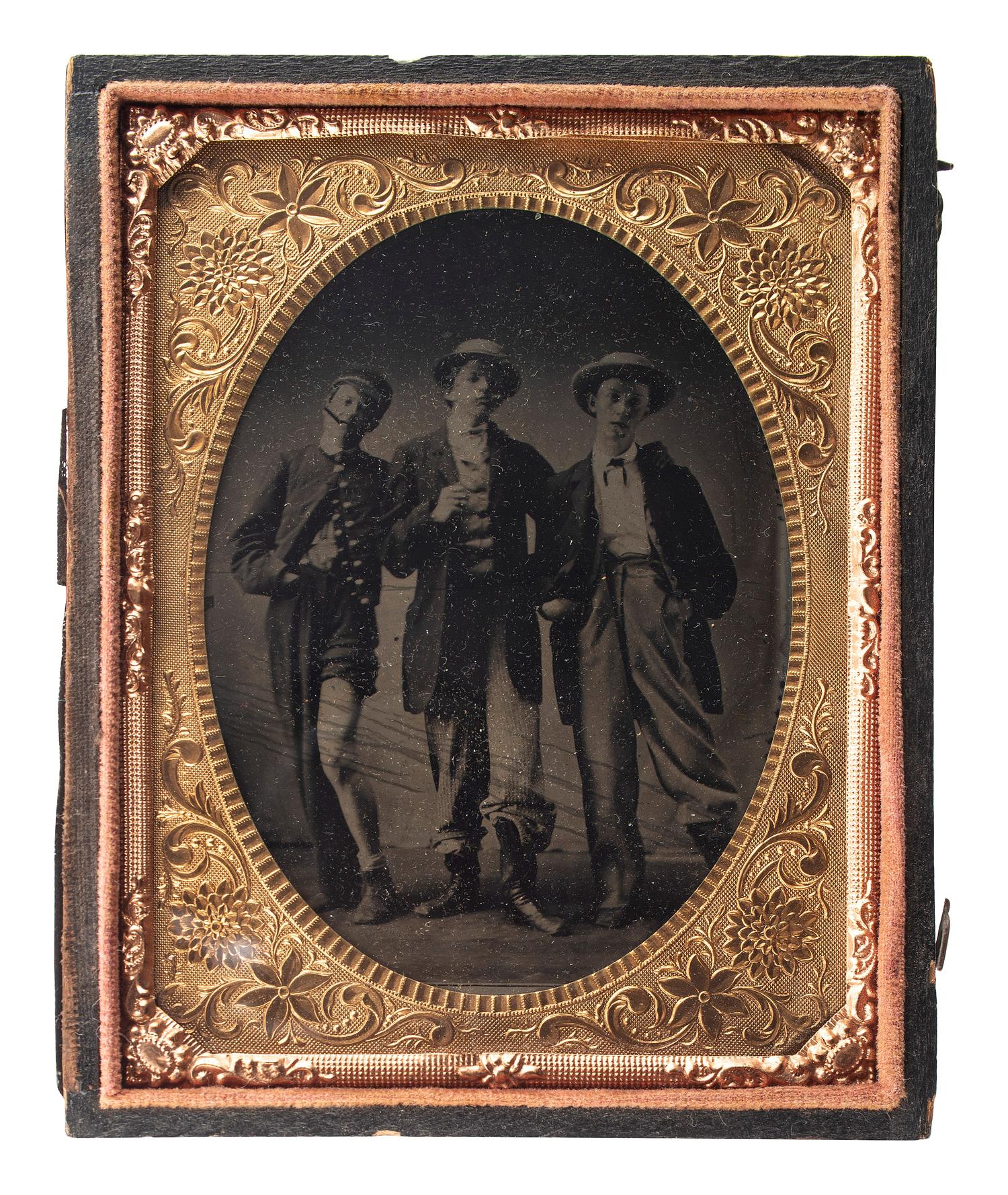 [EARLY PHOTOGRAPHY]. Quarter plate tintype of playful friends dressed in costume.