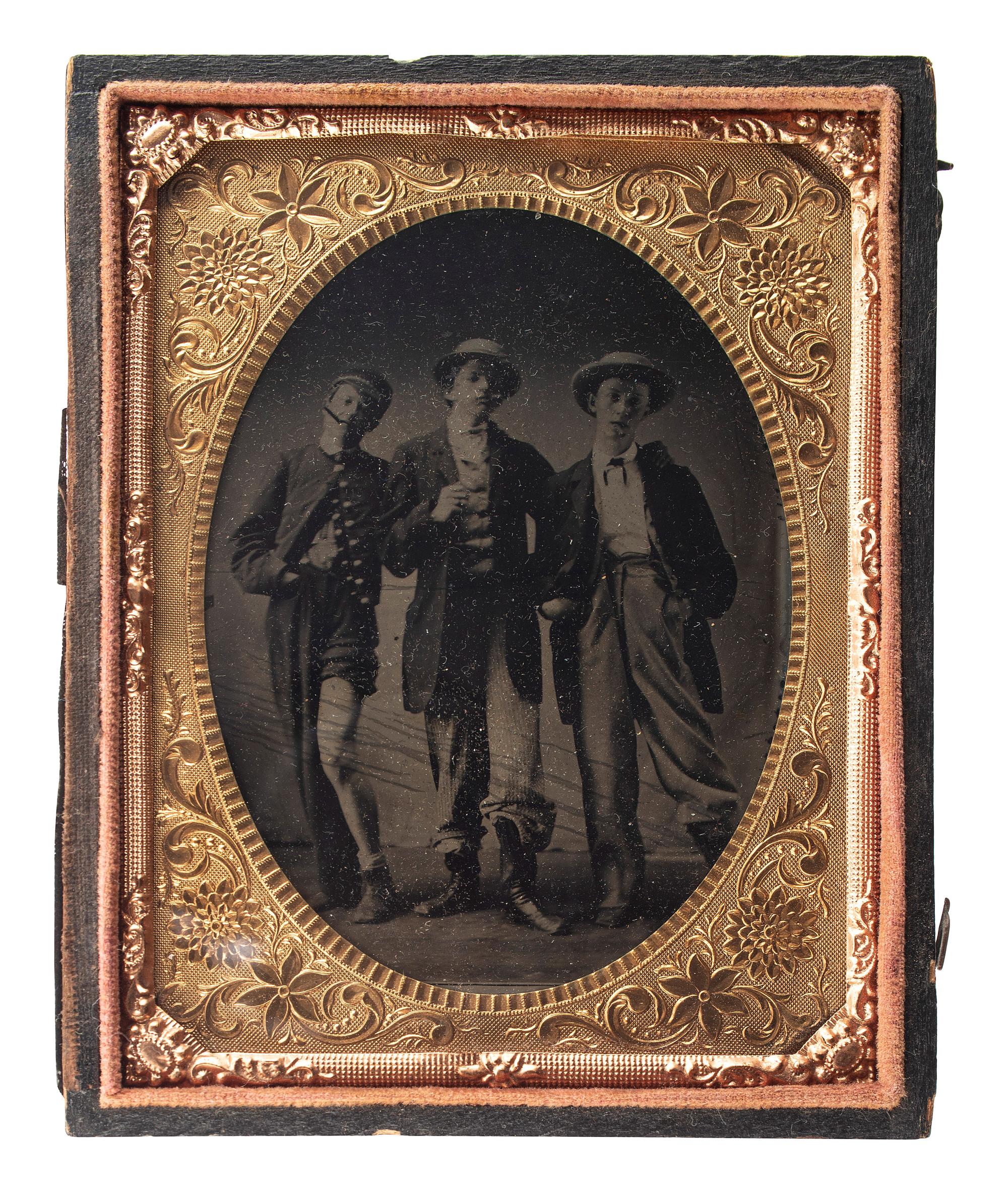[EARLY PHOTOGRAPHY]. Quarter plate tintype of playful friends dressed in costume.