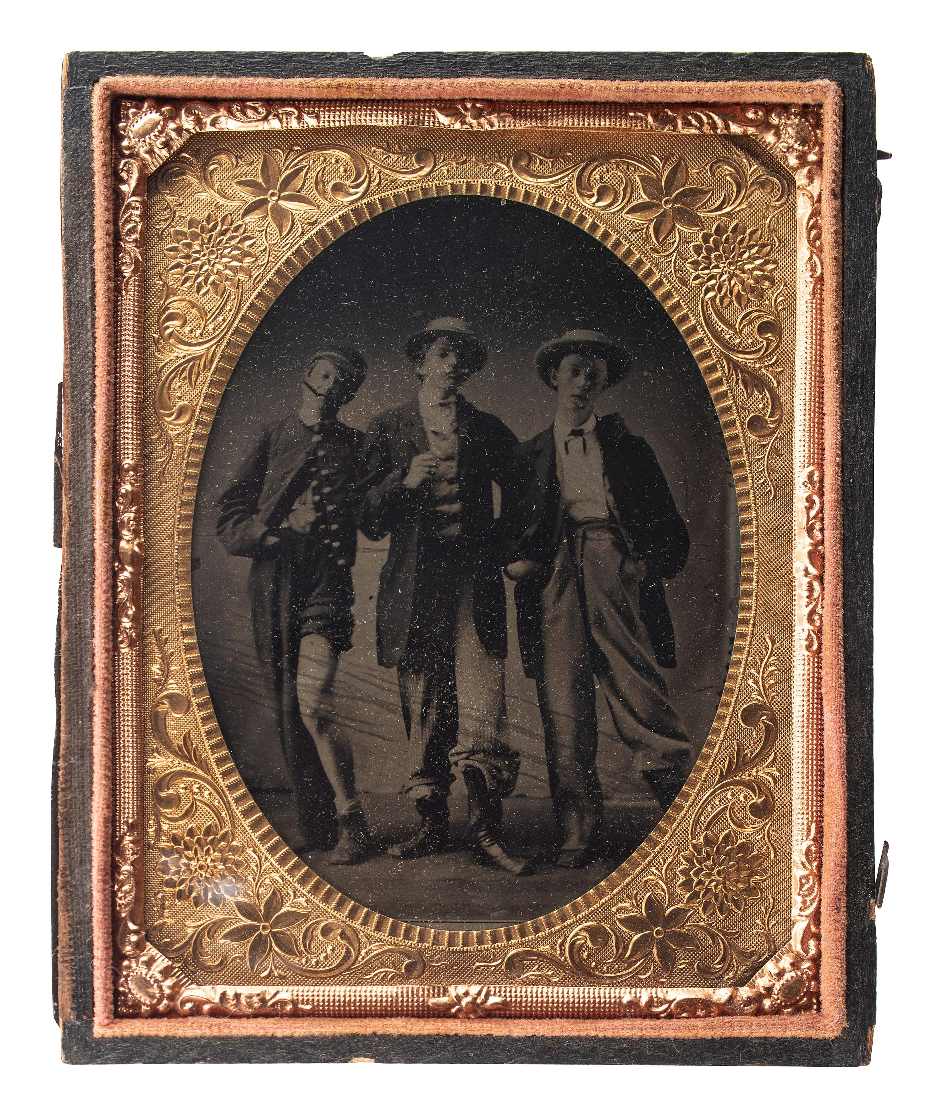[EARLY PHOTOGRAPHY]. Quarter plate tintype of playful friends dressed in costume.