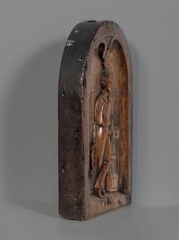 A Carved Walnut Ship Board Panel of a Sailor