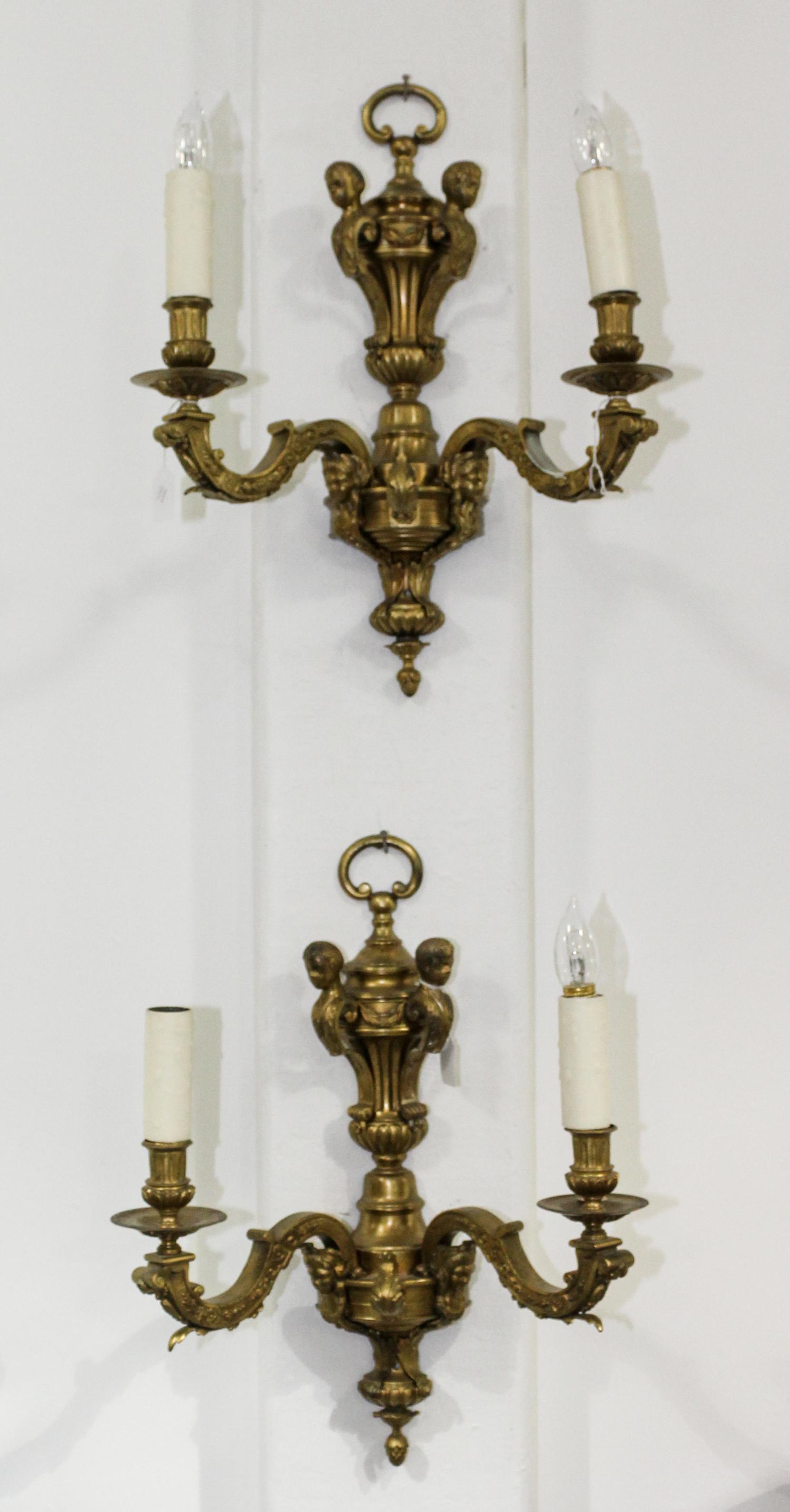 A Pair of Painted Metal Sconces. Length 38 inches.