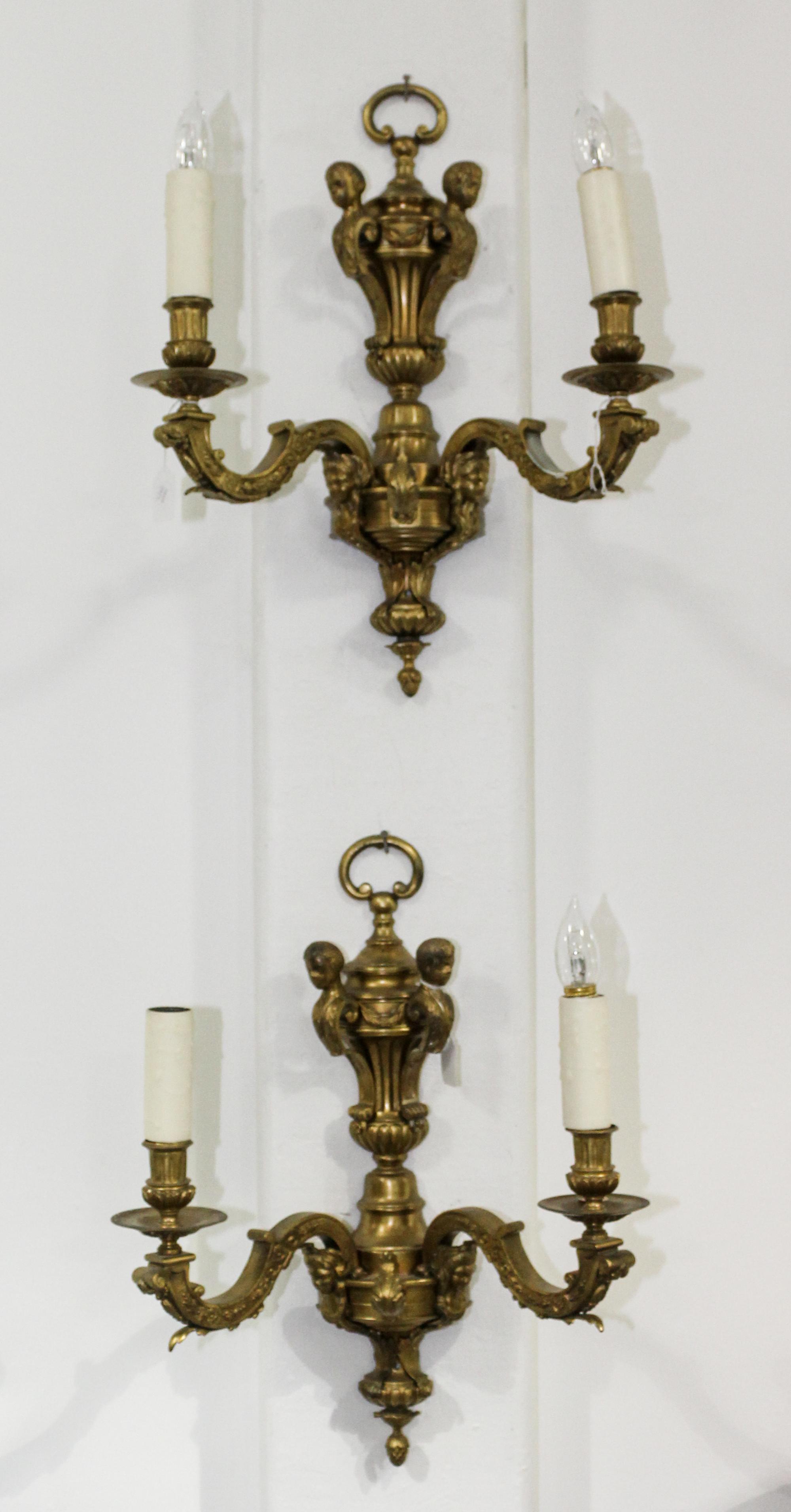 A Pair of Painted Metal Sconces. Length 38 inches.