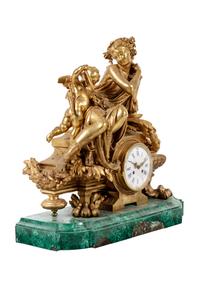 A Louis XV Style Gilt Metal Mounted Malachite Mantel Clock