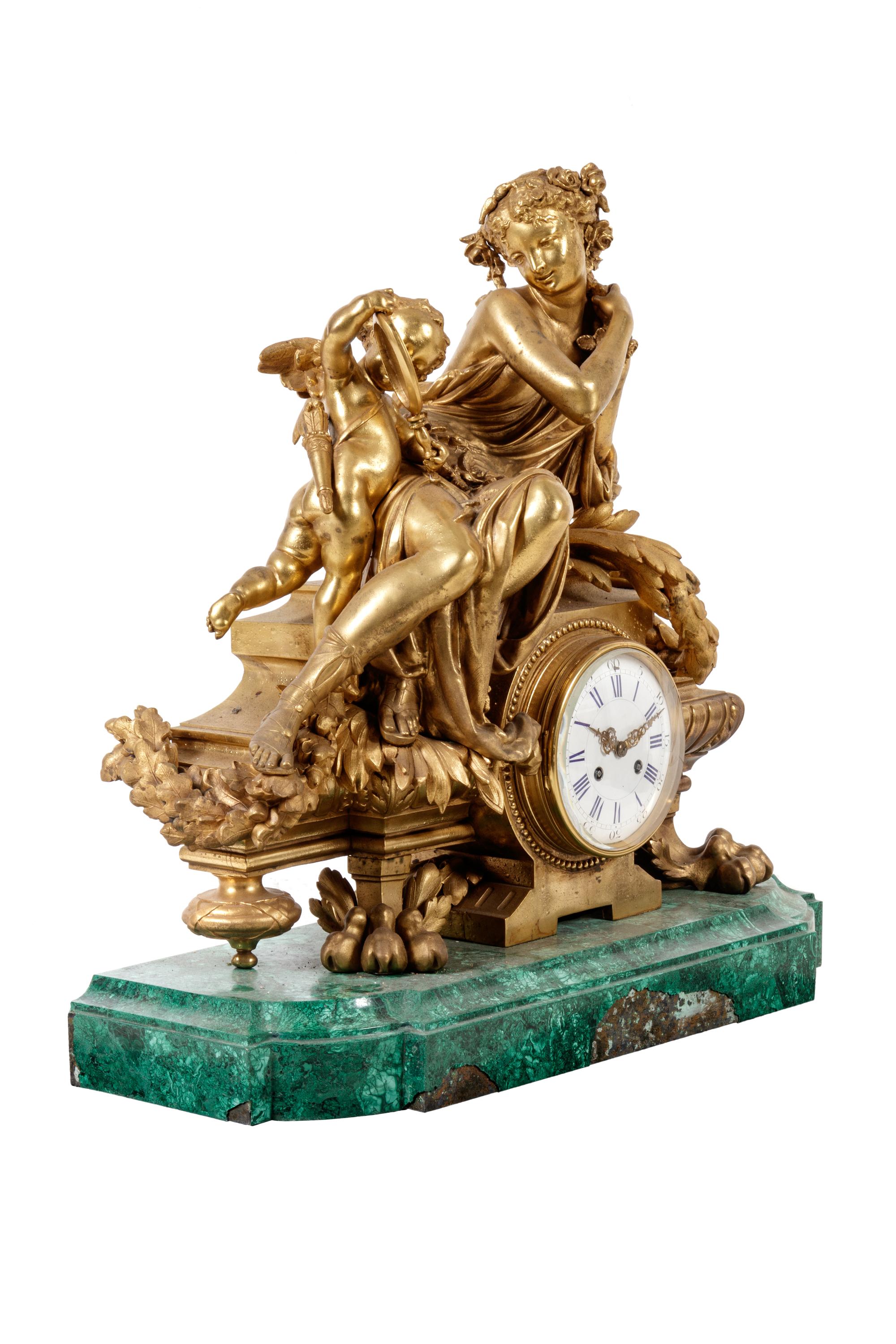 A Louis XV Style Gilt Metal Mounted Malachite Mantel Clock