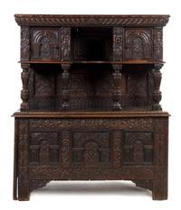 A Elizabethan Style Carved Oak Court Cupboard, Height 69 3/4 x width 58 1/2 x depth 24 1/4 inches.