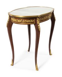 A Louis XV Style Gilt Bronze Mounted Table