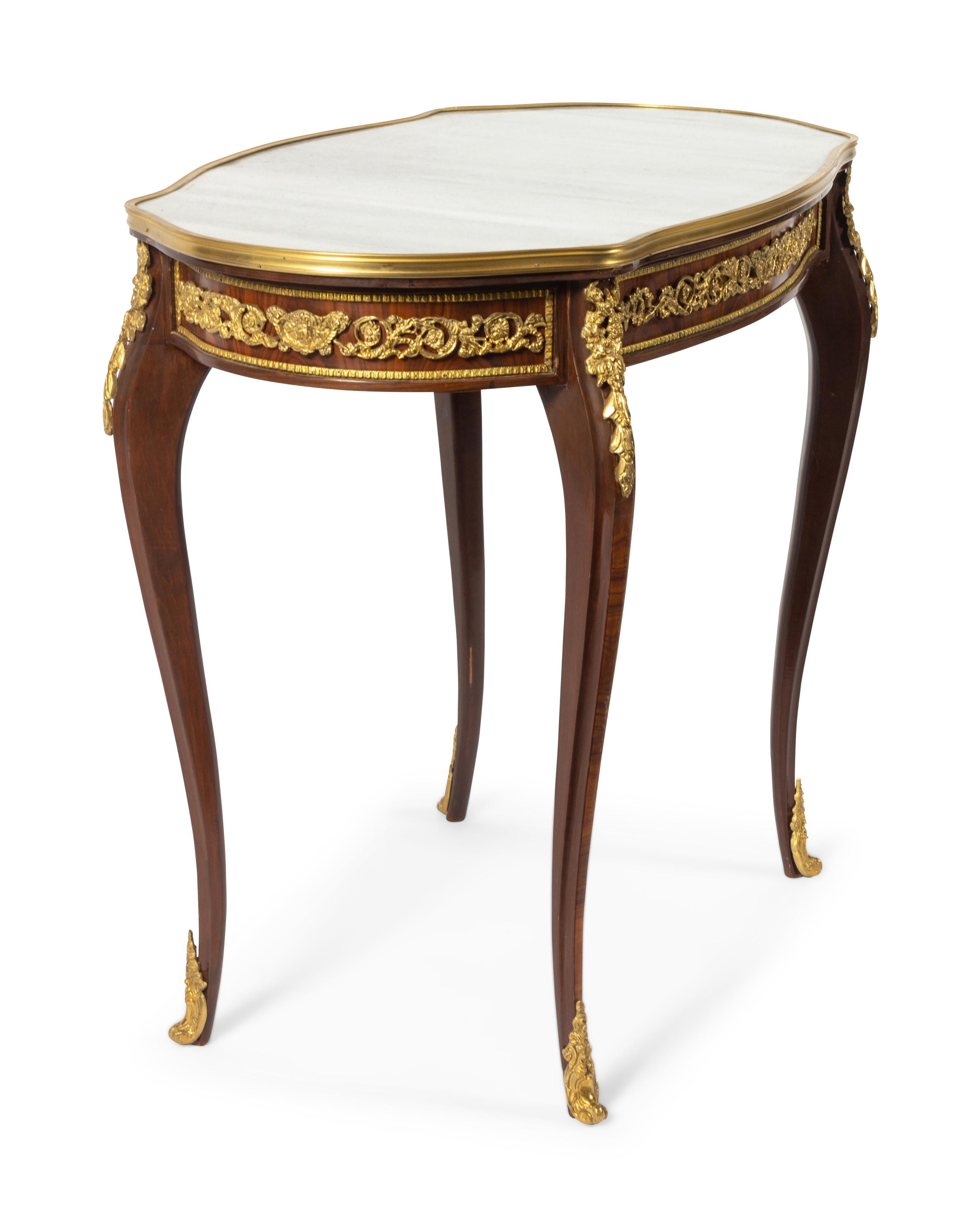 A Louis XV Style Gilt Bronze Mounted Table